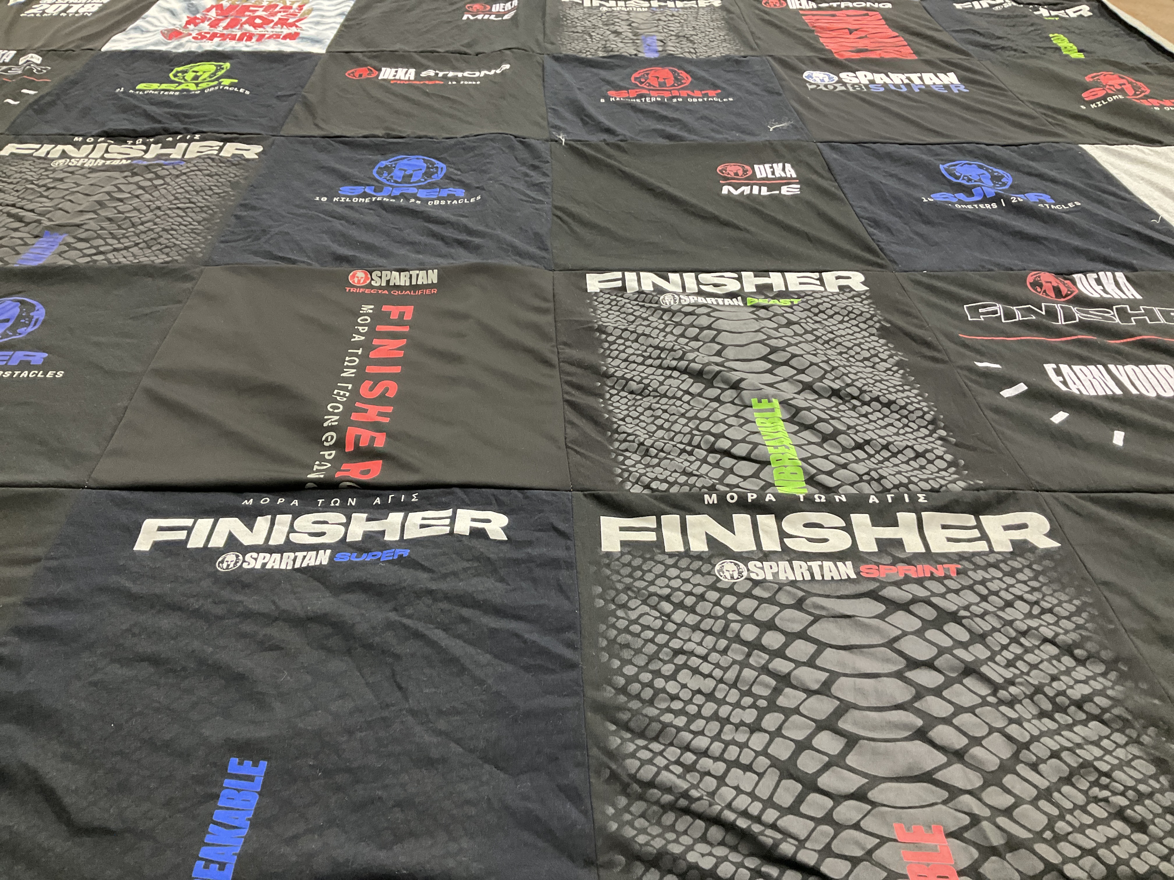 T-shirt quilt with obstacle course racing, fitness themes by Sharon from NY
