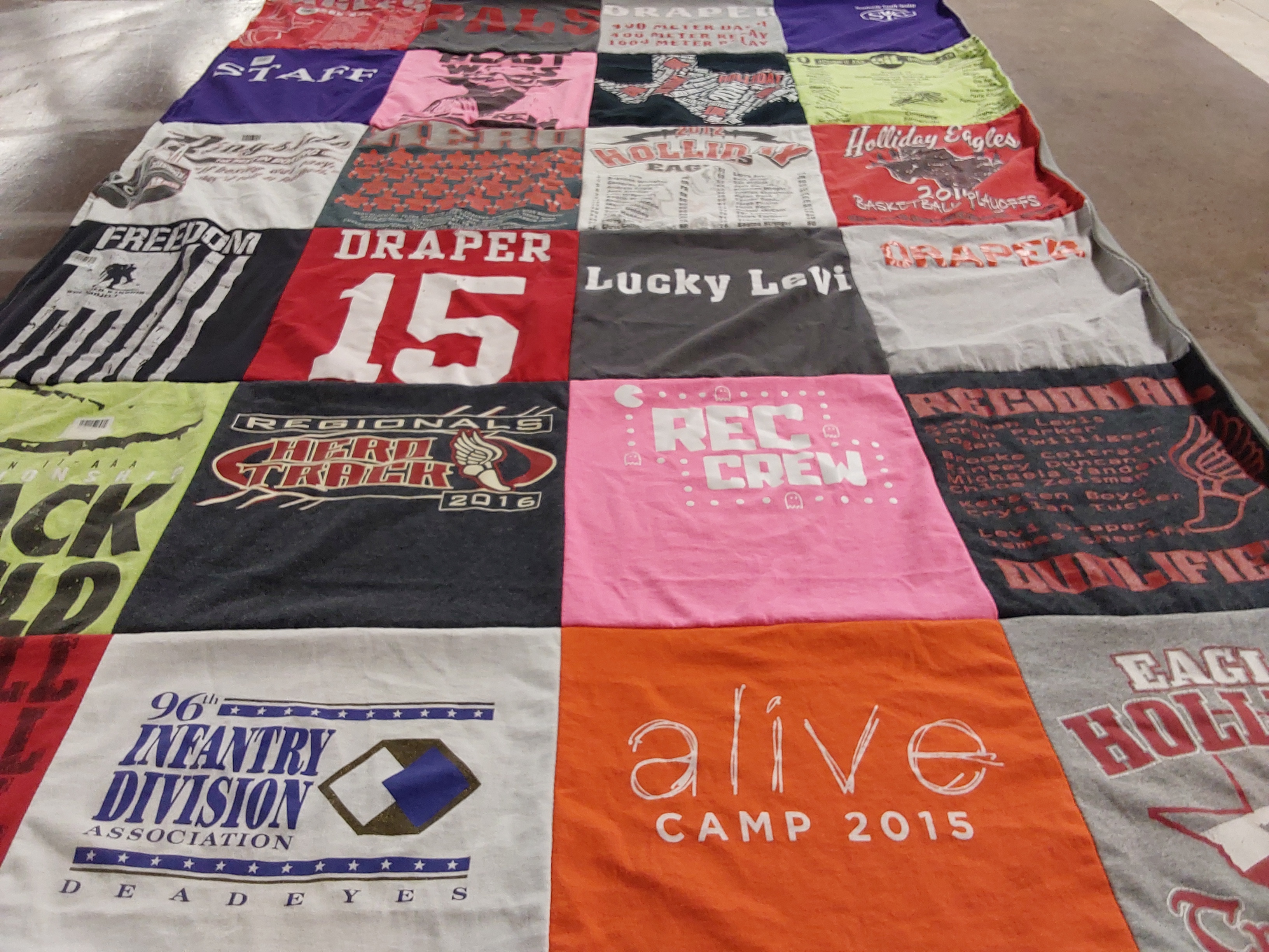 T-shirt quilt featuring holiday eagles, track team by Linda from TX