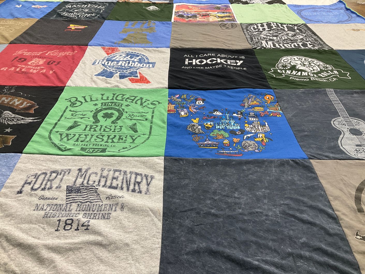 T-shirt quilt with hockey, disney themes by Karen from CA