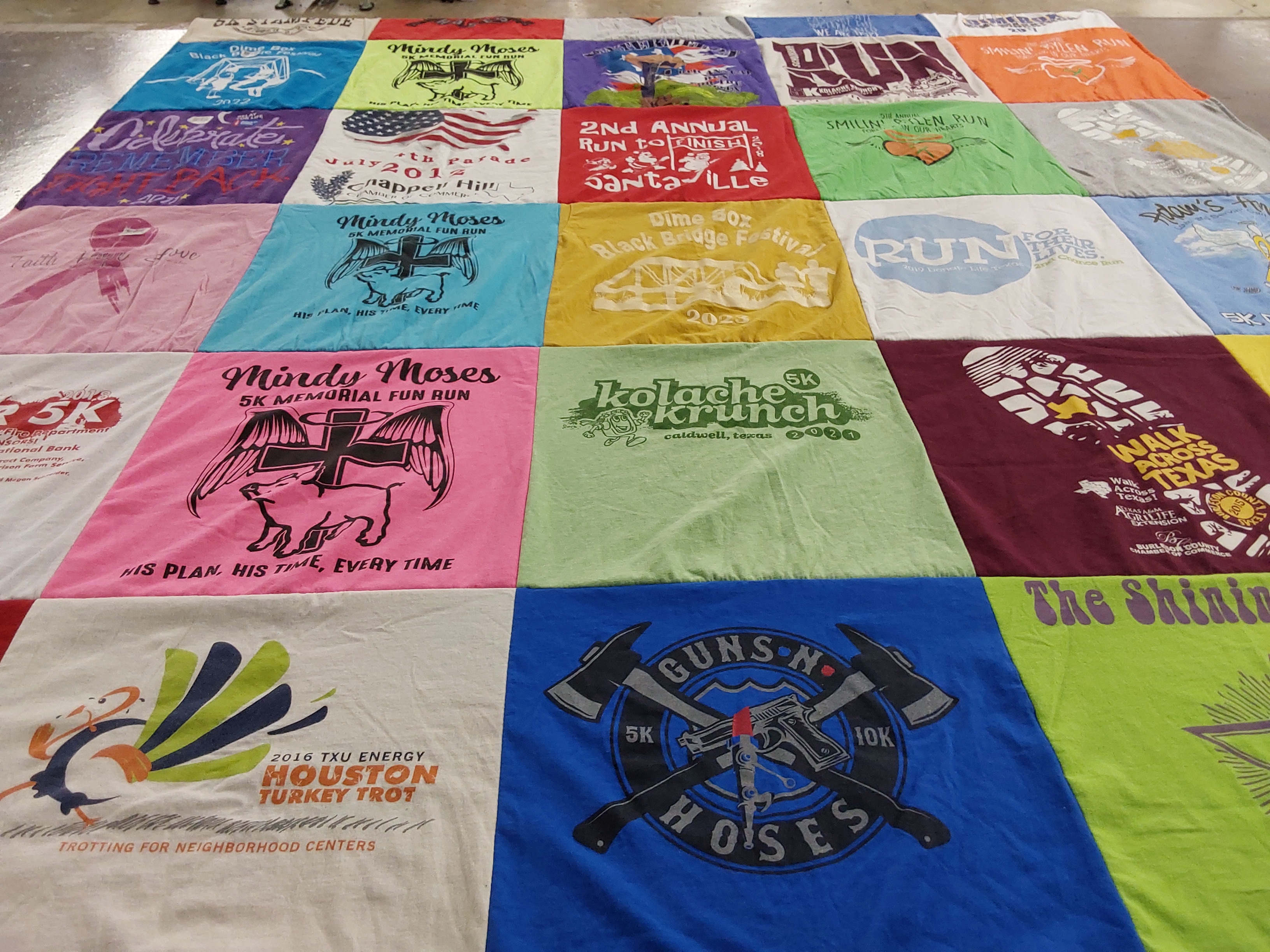 T-shirt quilt with running, community events themes by Angelia from TX