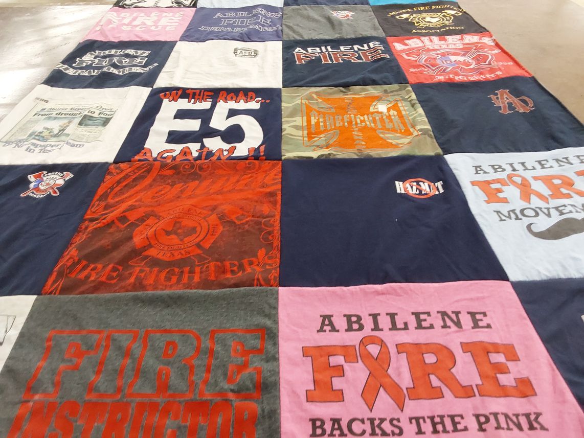 T-shirt quilt with firefighting, community service themes by Dina from TX