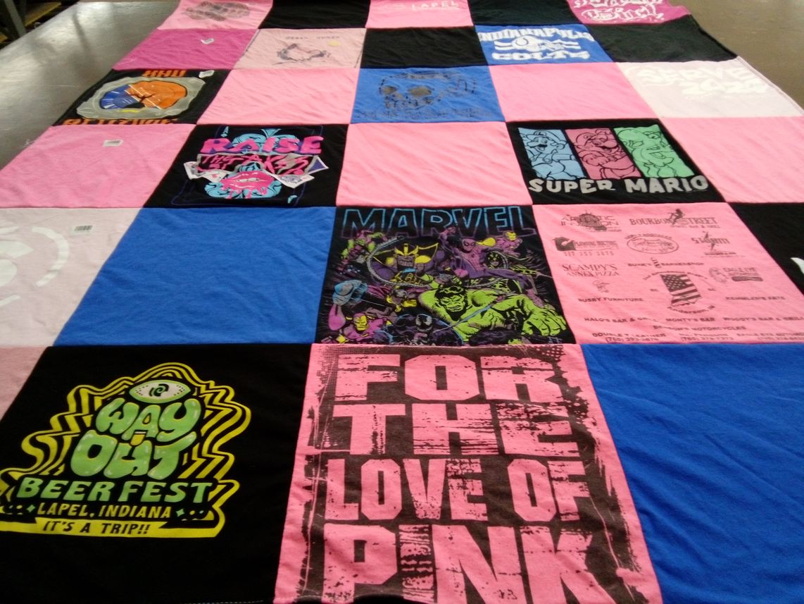 T-shirt quilt with beer festivals, superheroes themes by Robin from IN