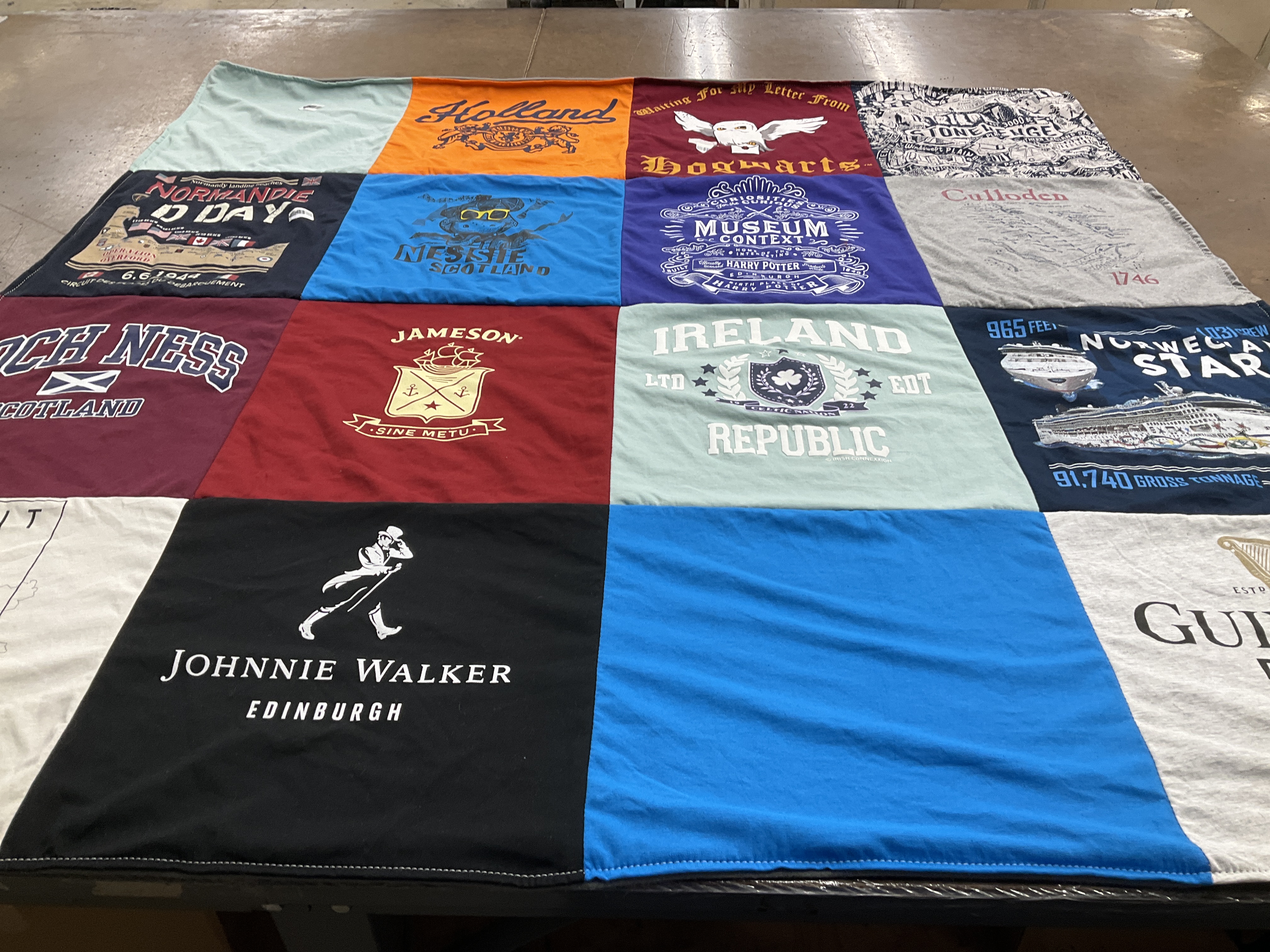 T-shirt quilt with travel, beverages themes by Tamisha from TX