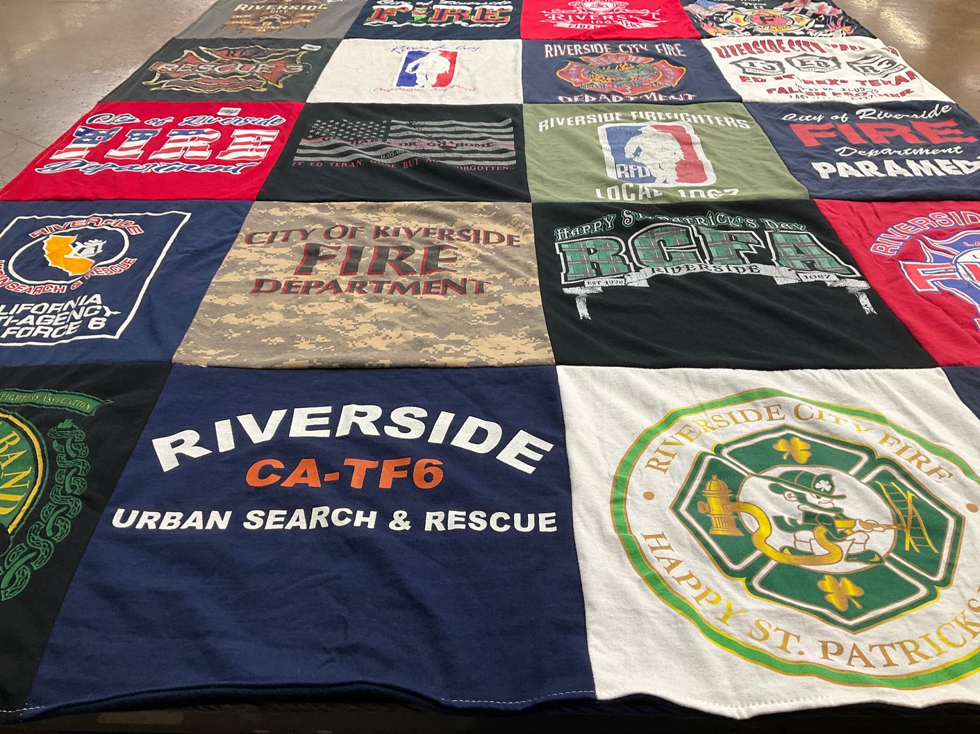 T-shirt quilt with firefighting, emergency services themes by Monique from CA