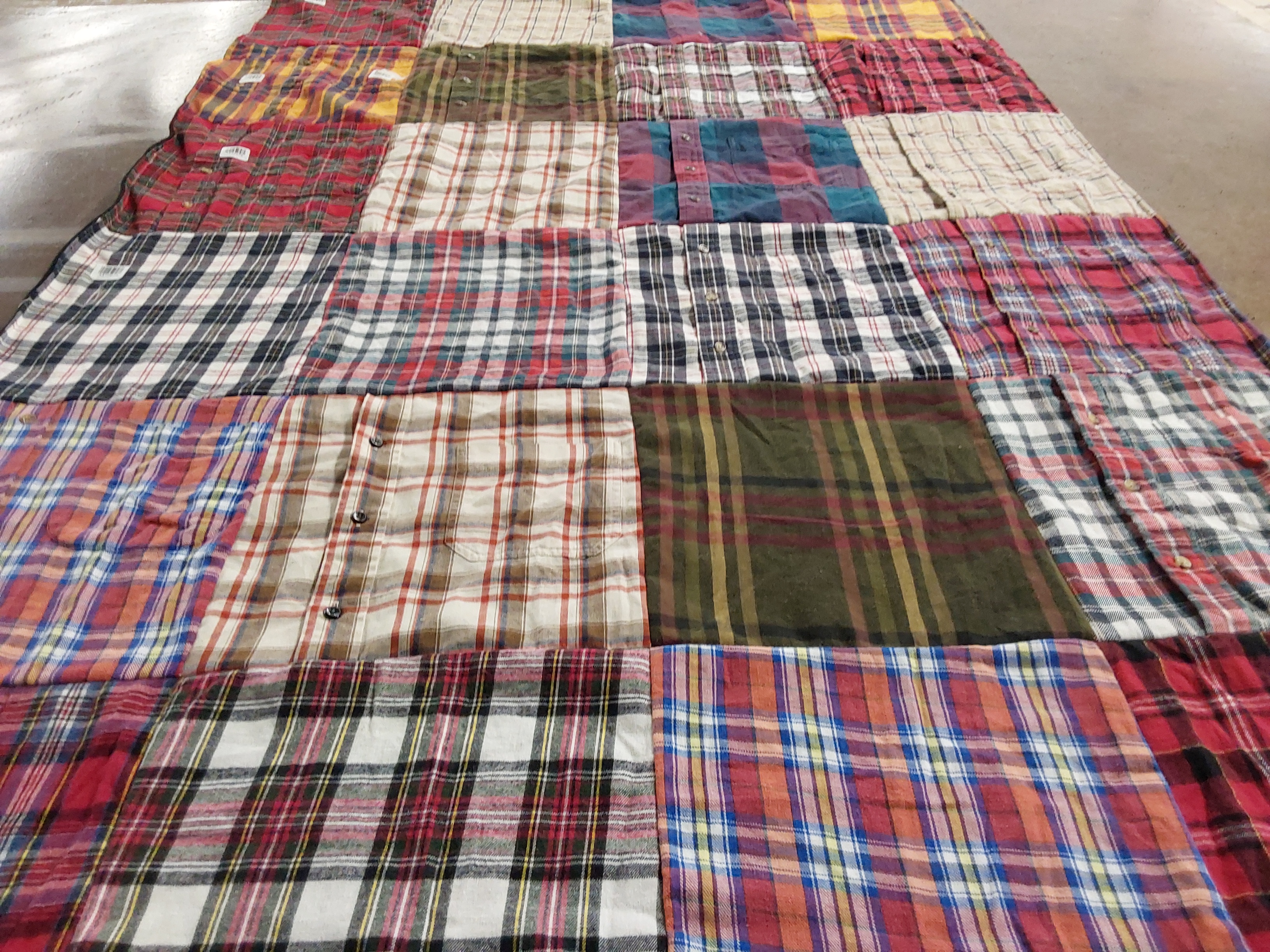 T-shirt quilt with quilting, textiles themes by Julie from NC