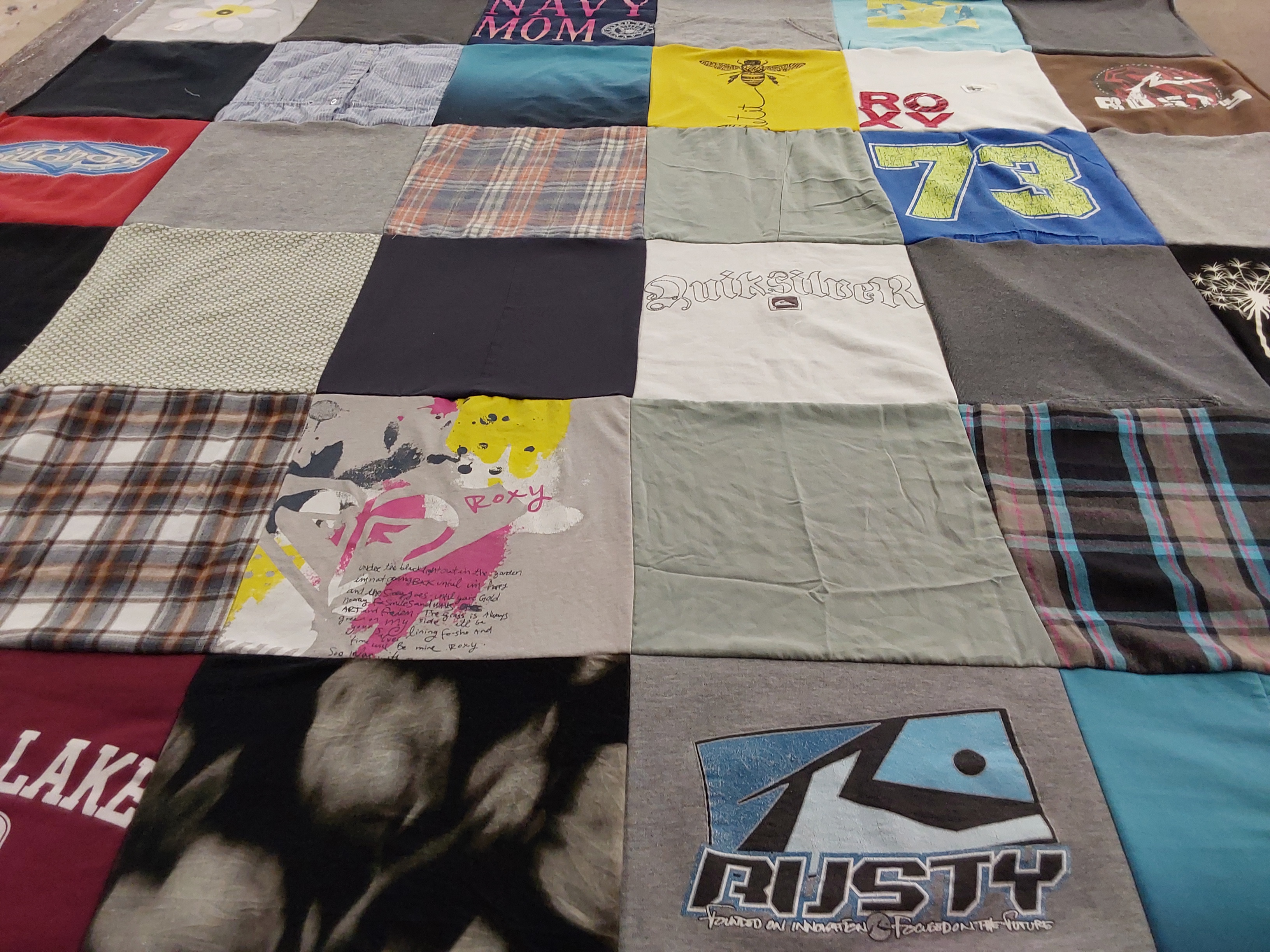 T-shirt quilt with surfing, outdoors themes by Erin from CA