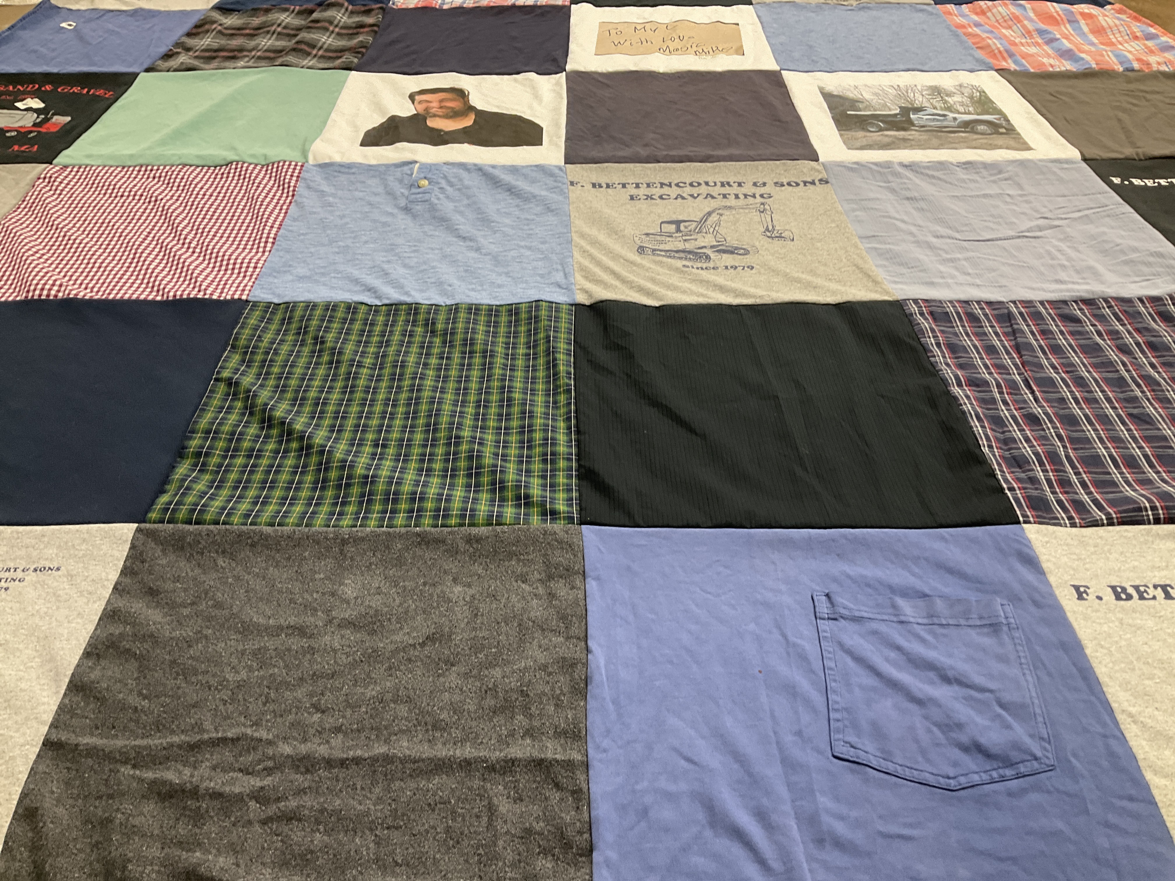 T-shirt quilt with construction, family themes by Linda from MA