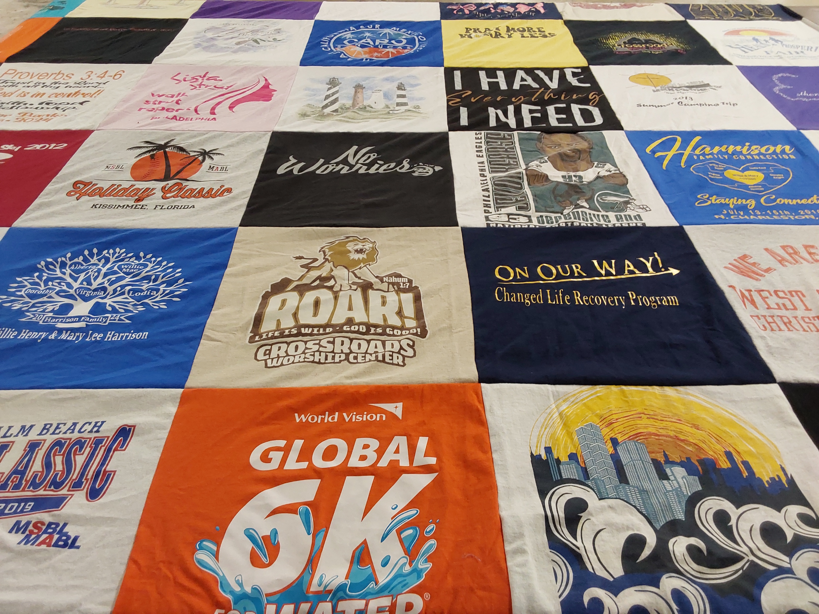 T-shirt quilt with family, faith themes by Mary from NJ