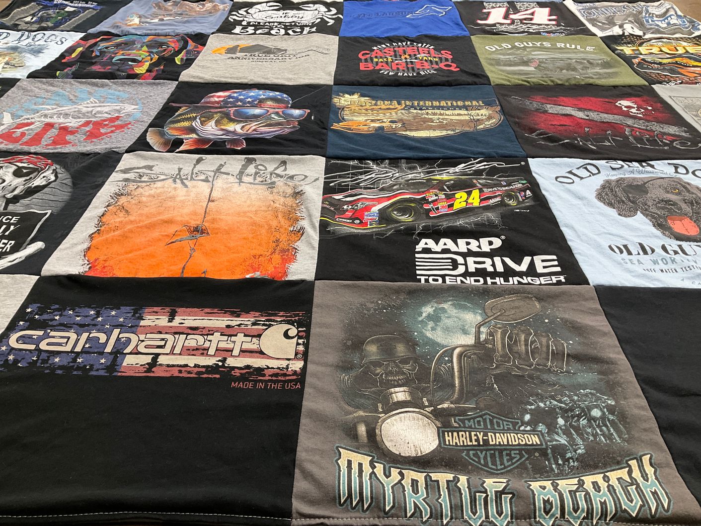 T-shirt quilt with fishing, motorcycles themes by Cindy from CO