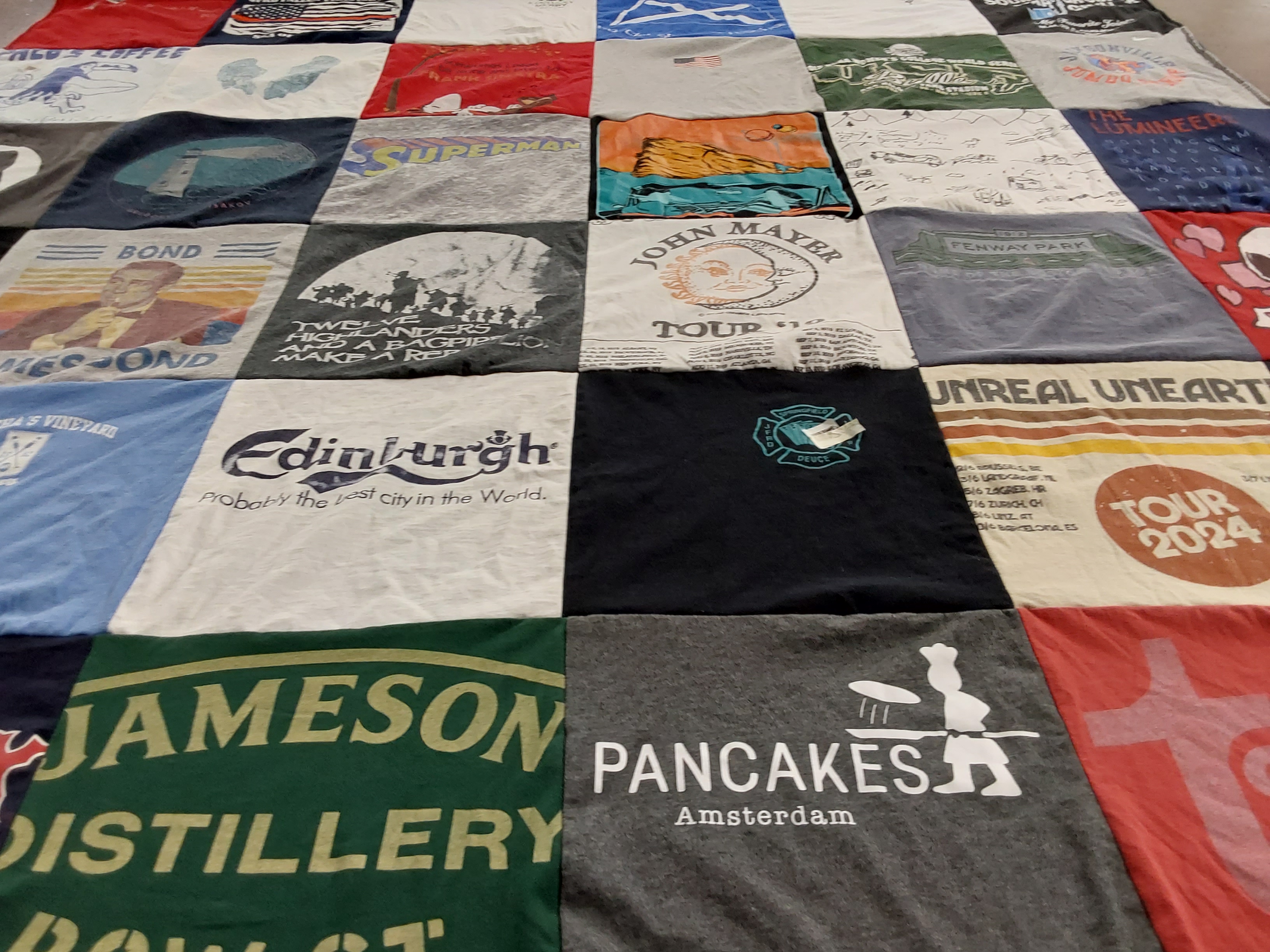 T-shirt quilt with music, travel themes by Susan from FL