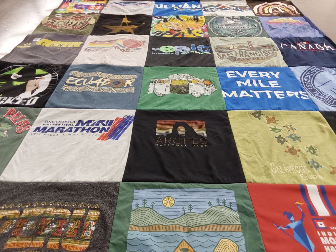 T-shirt quilt with travel, running themes by Mary from IN