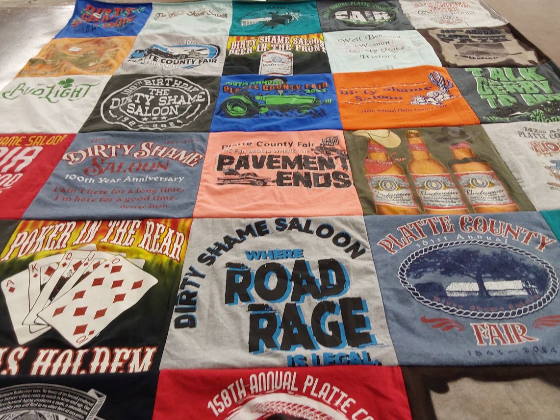 T-shirt quilt with beer festivals, gambling themes by Katie from MO