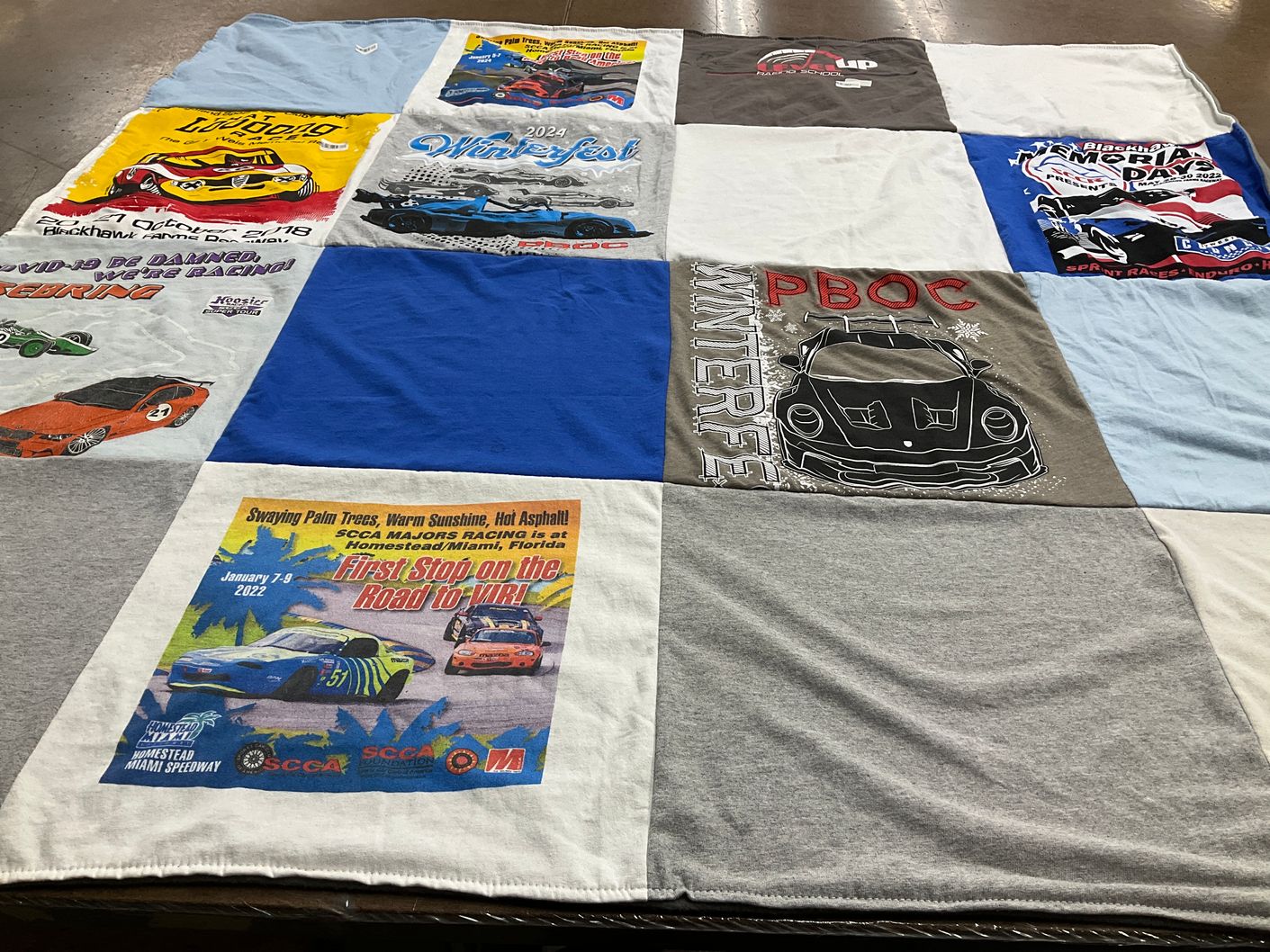 T-shirt quilt with car racing themes by Leslie from IL
