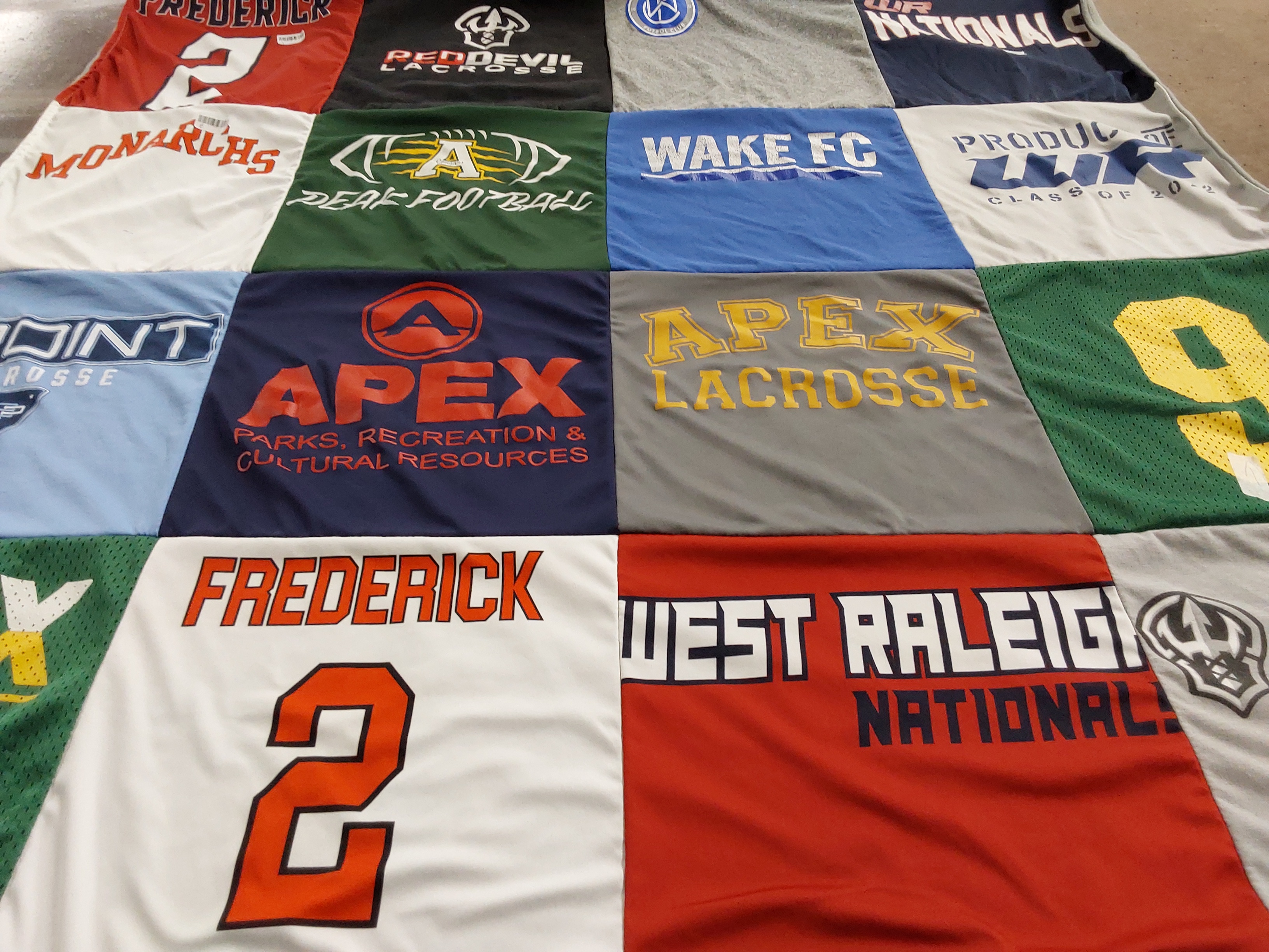 T-shirt quilt with lacrosse, football themes by Jennifer from NC