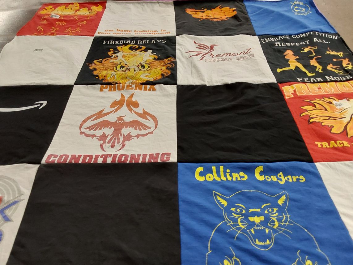 T-shirt quilt featuring collins cougars, fremont track team by Vidya from CA