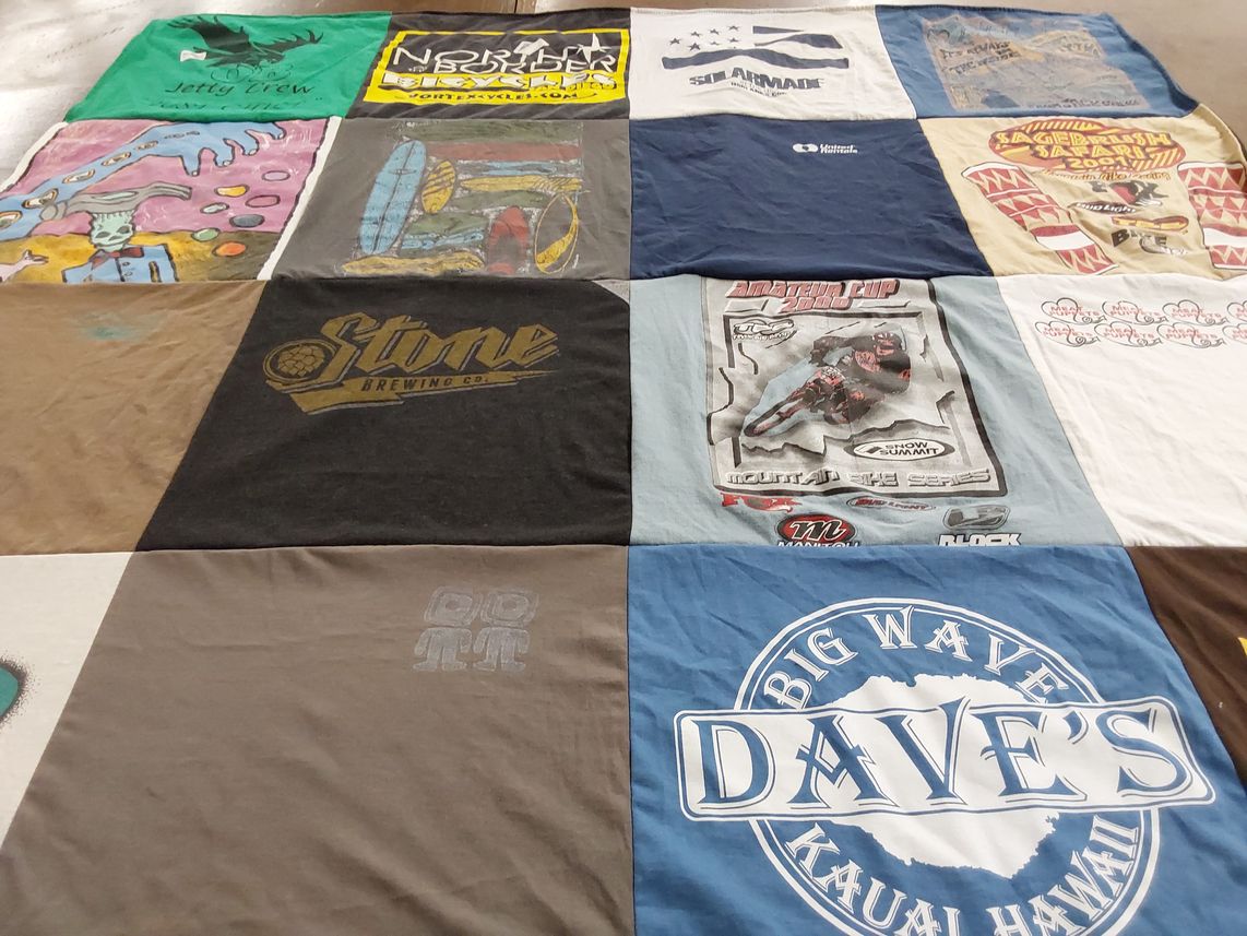 T-shirt quilt with brewing, mountain biking themes by Jeanette from CA