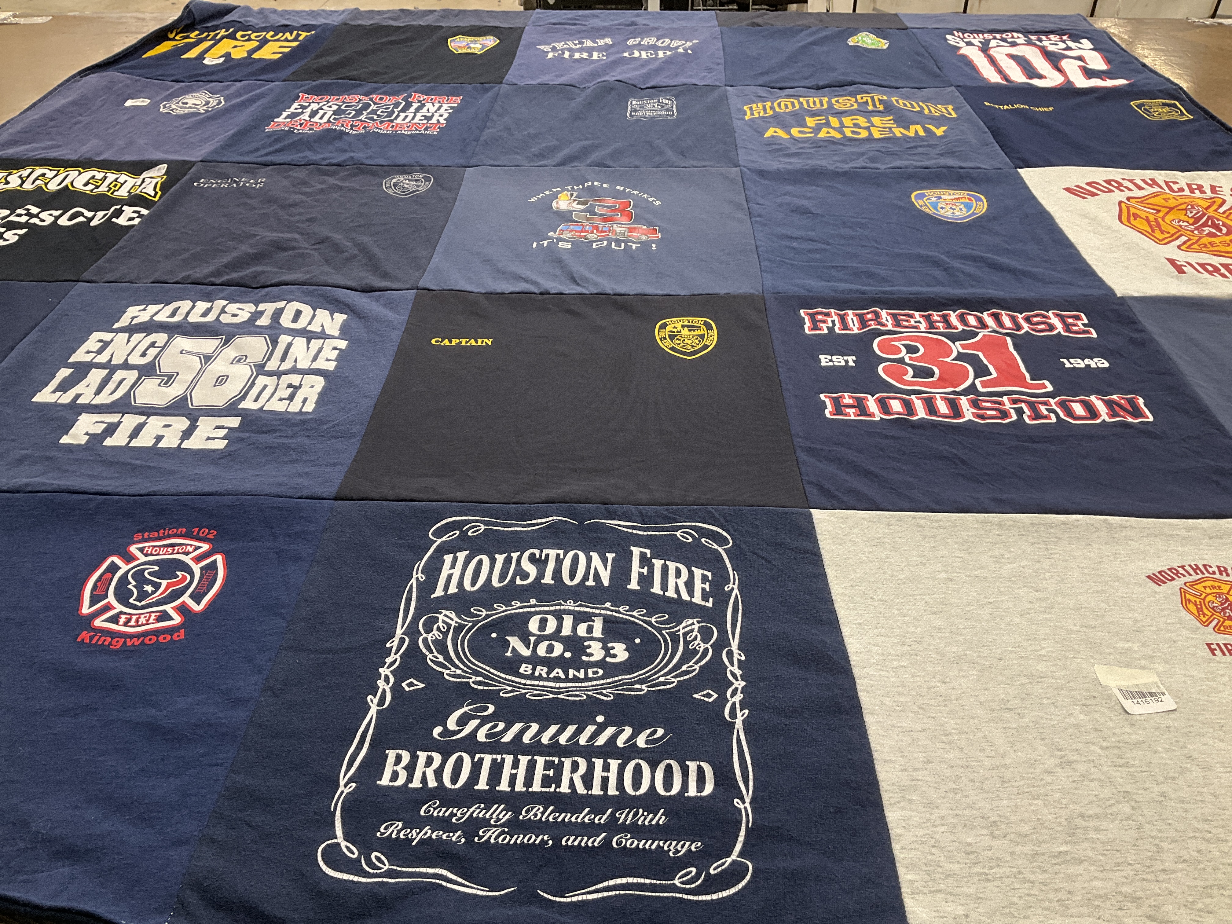 T-shirt quilt with firefighting, community service themes by Melissa from TX