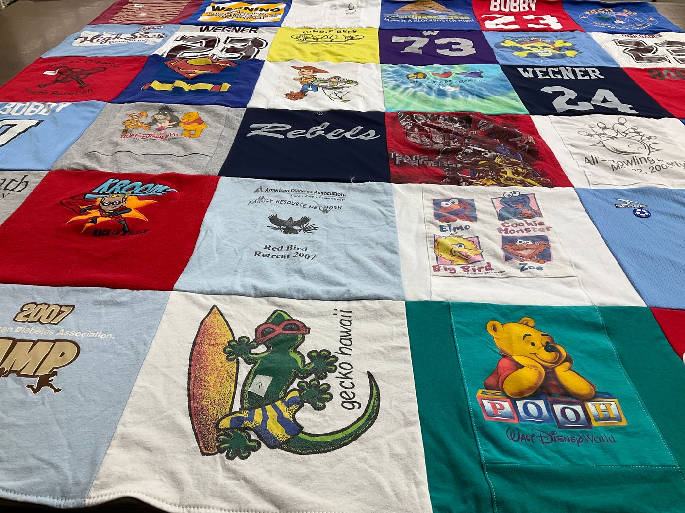 T-shirt quilt with disney, cartoons themes by Anne from MO