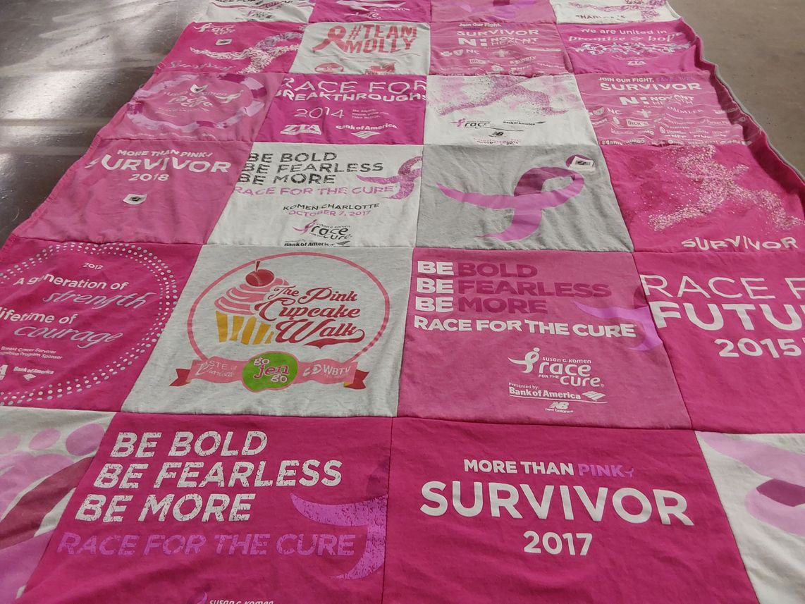 T-shirt quilt with breast cancer awareness, community support themes by Marie from NC