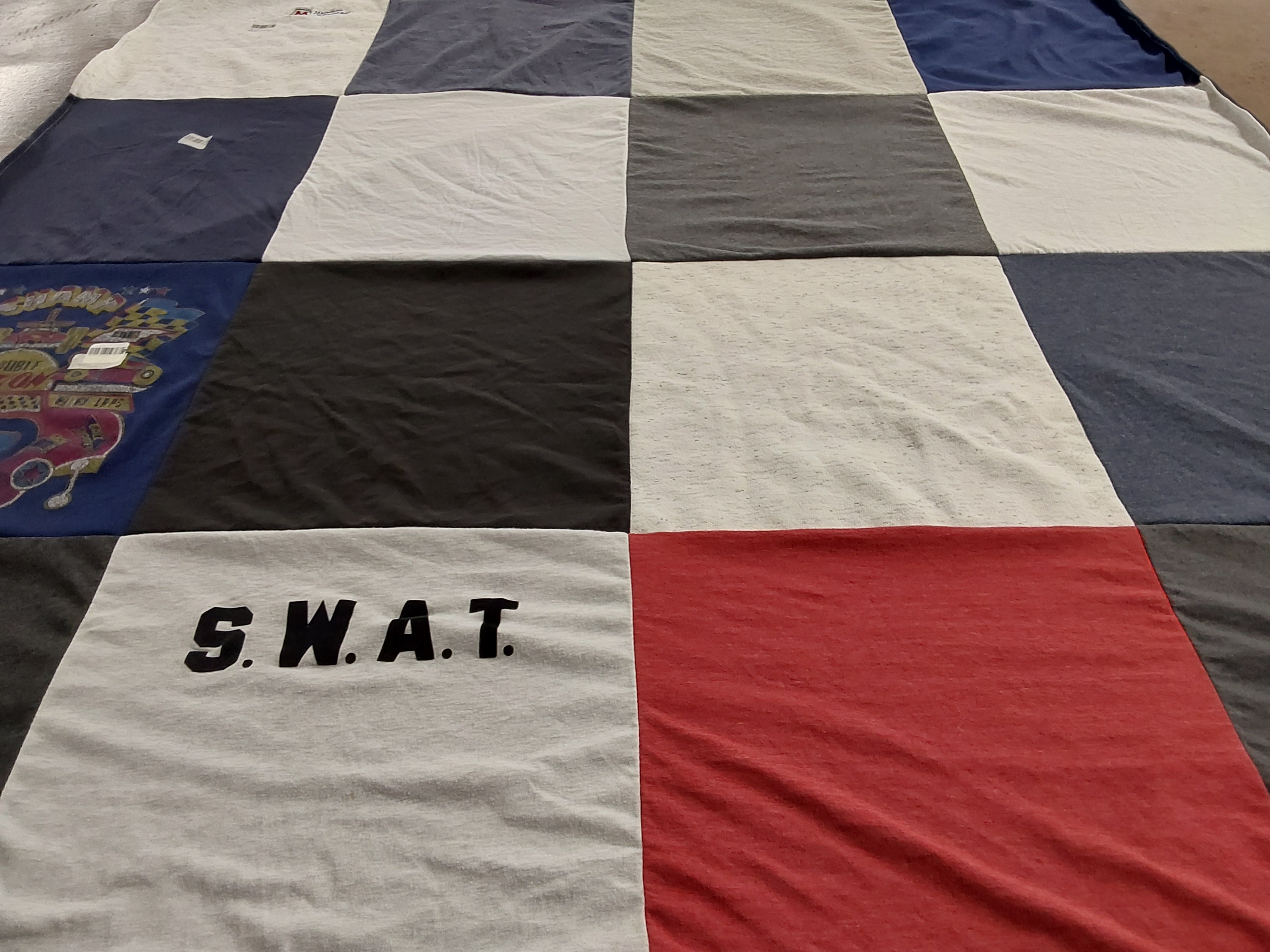 T-shirt quilt with law enforcement, public safety themes by Kamara from MN