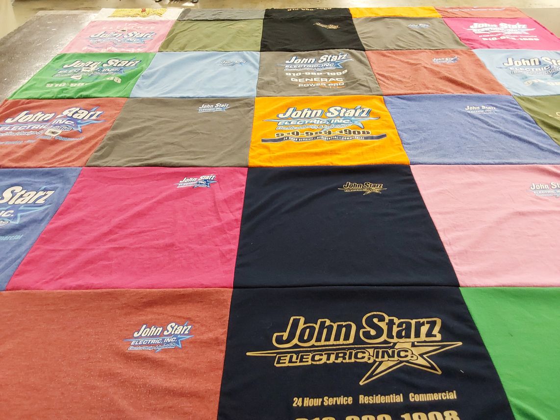 T-shirt quilt with electricity, construction themes by Christyann from NC