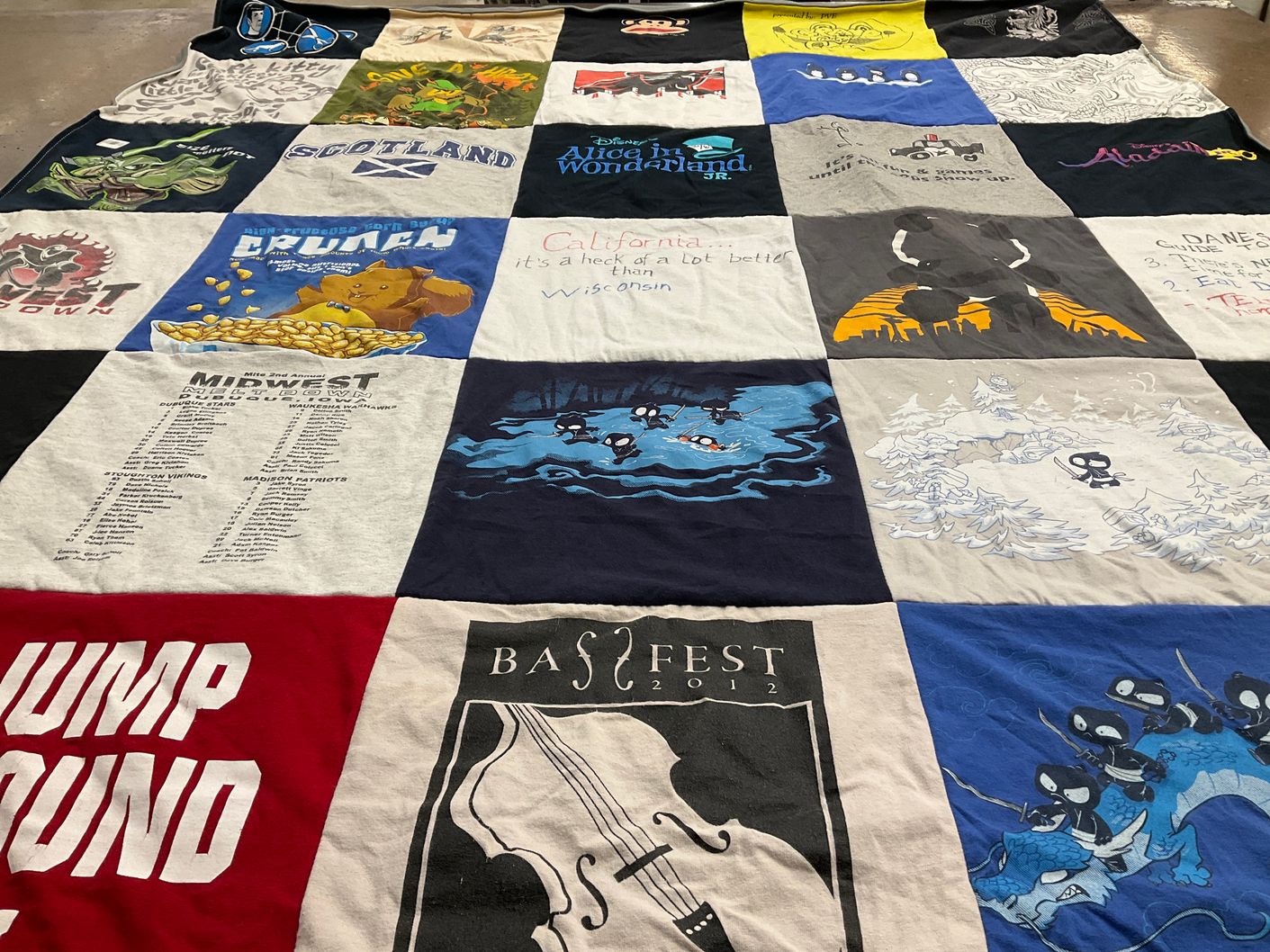 T-shirt quilt with travel, music themes by Jefre from WI