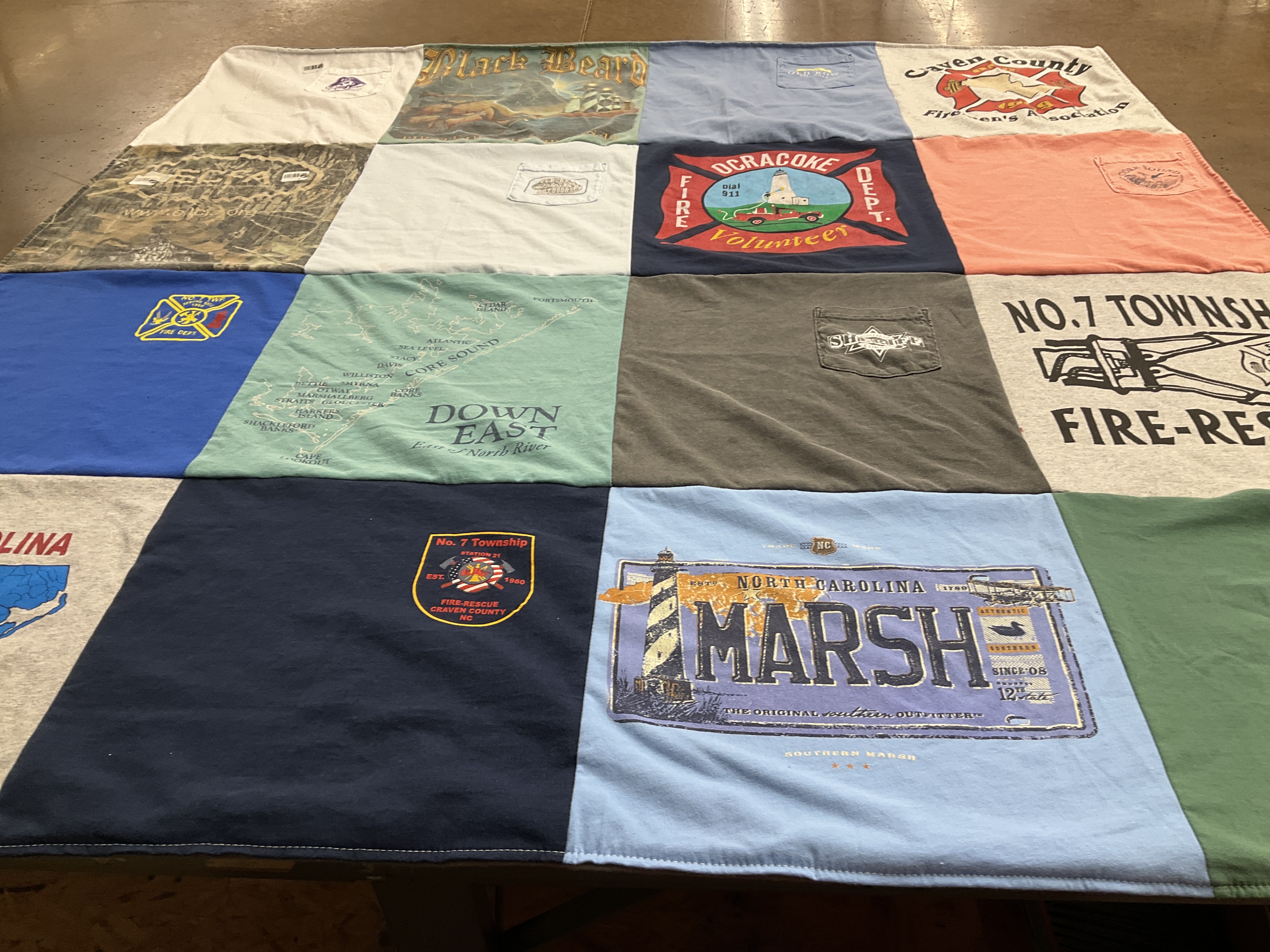 T-shirt quilt with firefighting, community service themes by Mary from NC