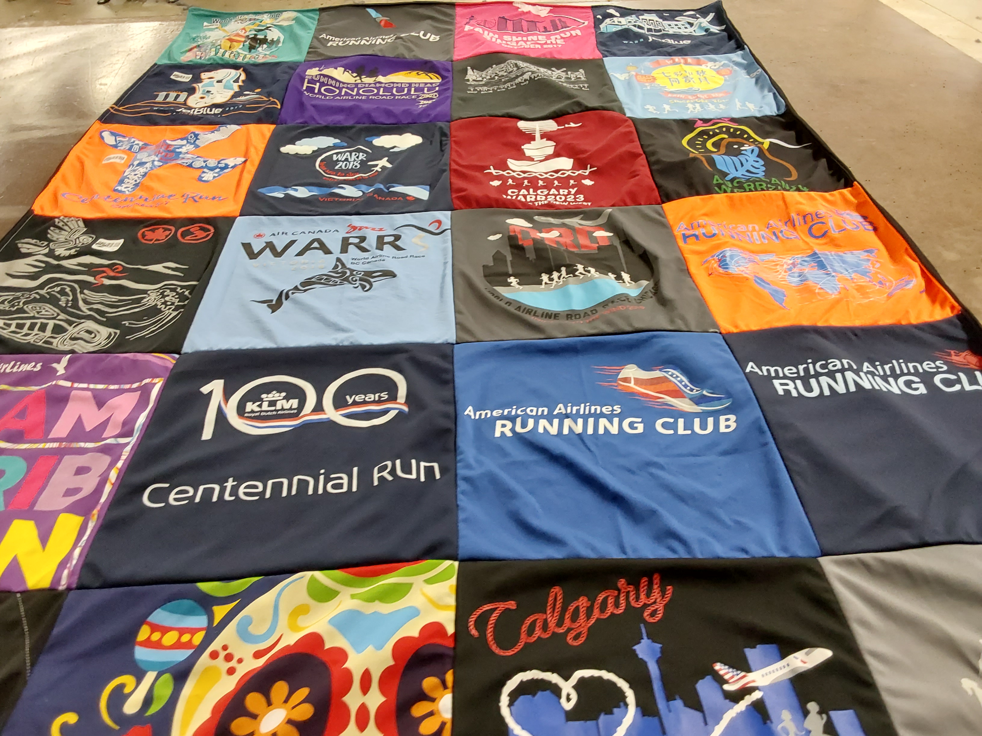 T-shirt quilt with running, travel themes by Jayne from KY