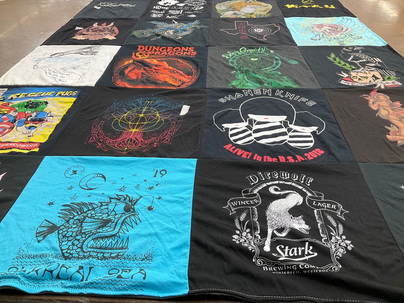 T-shirt quilt with board games, music themes by Robbi from TX