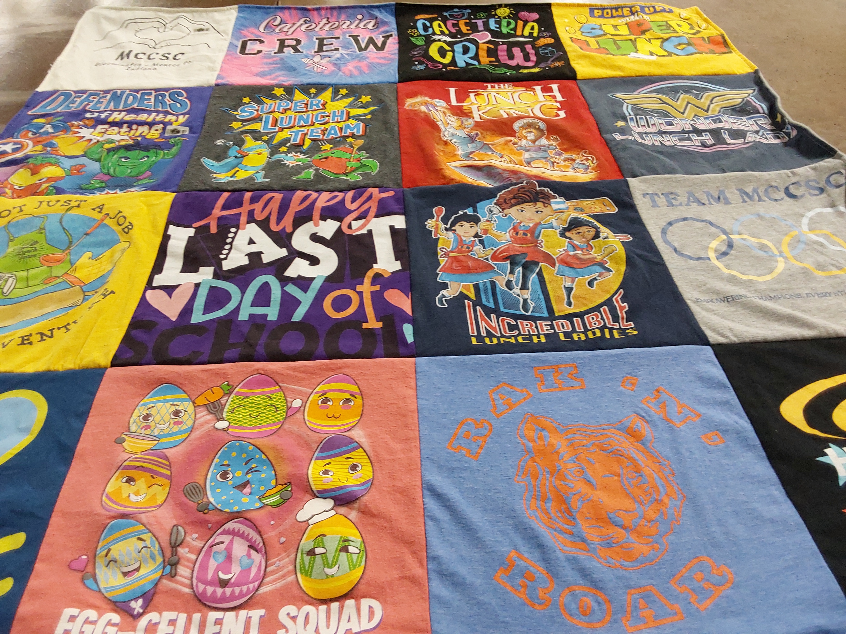 T-shirt quilt with healthy eating, school activities themes by Grace from IN