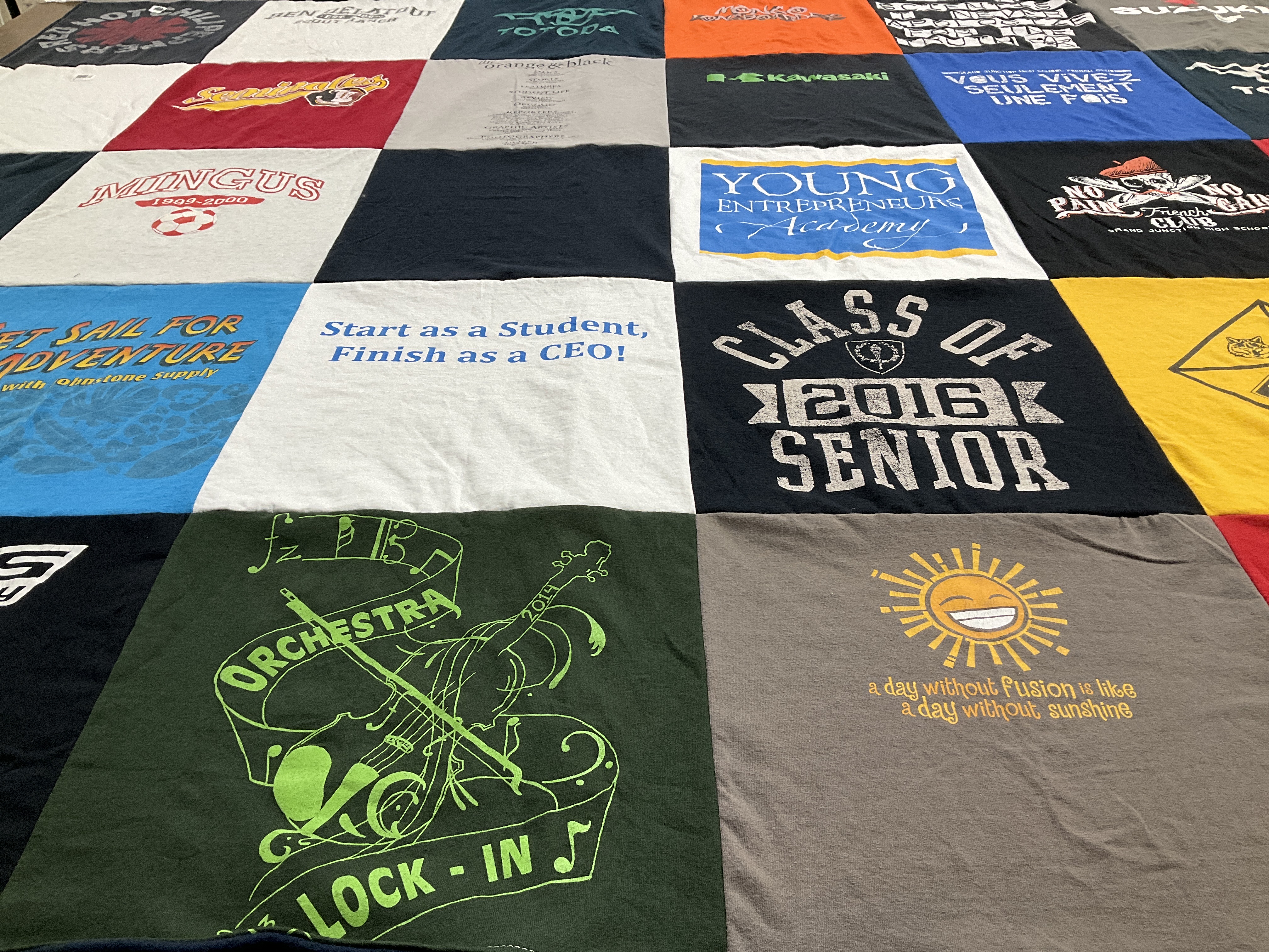 T-shirt quilt with entrepreneurship, music themes by Jodee from CO