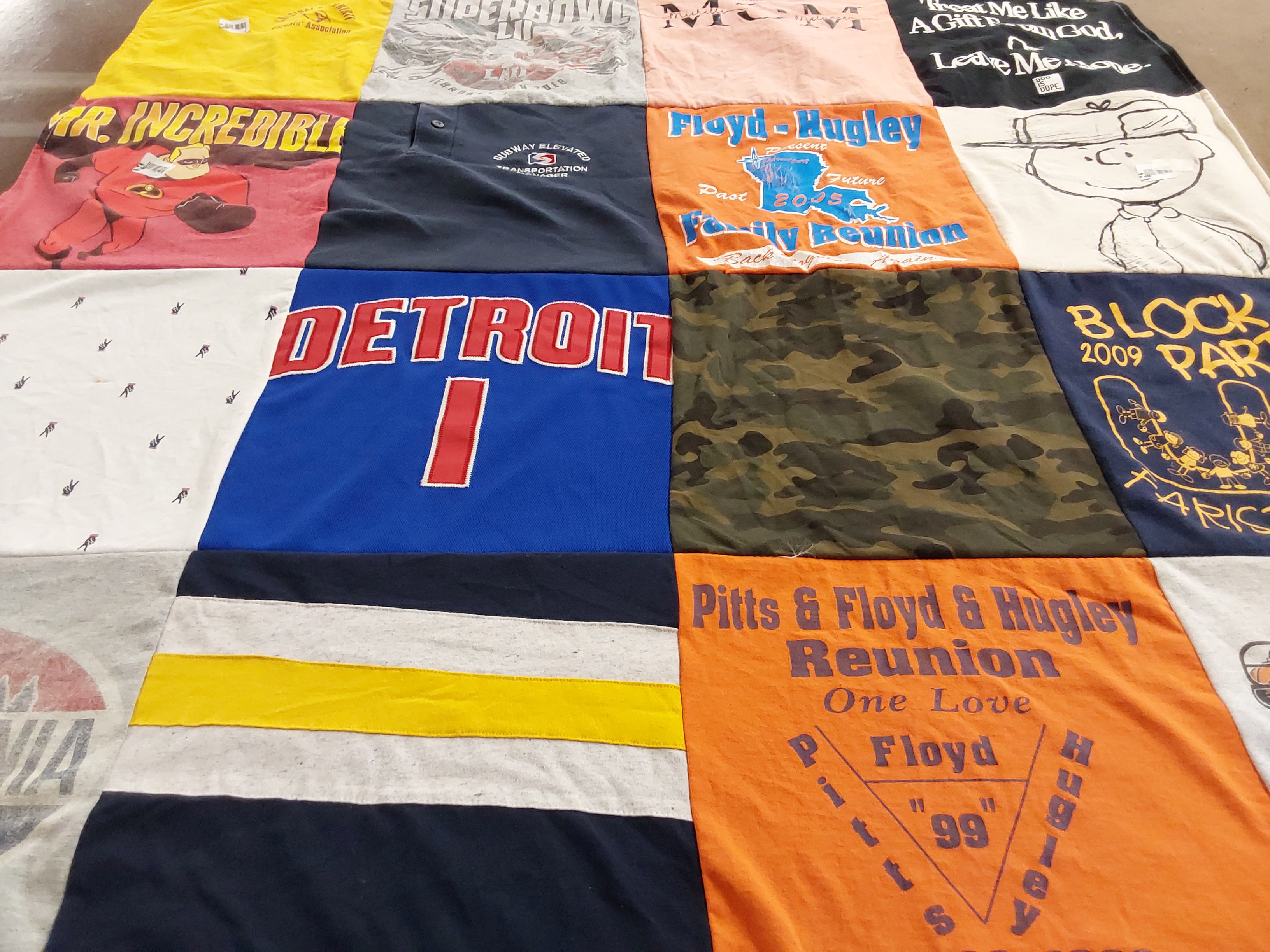 T-shirt quilt with family, community themes by Melanie from PA