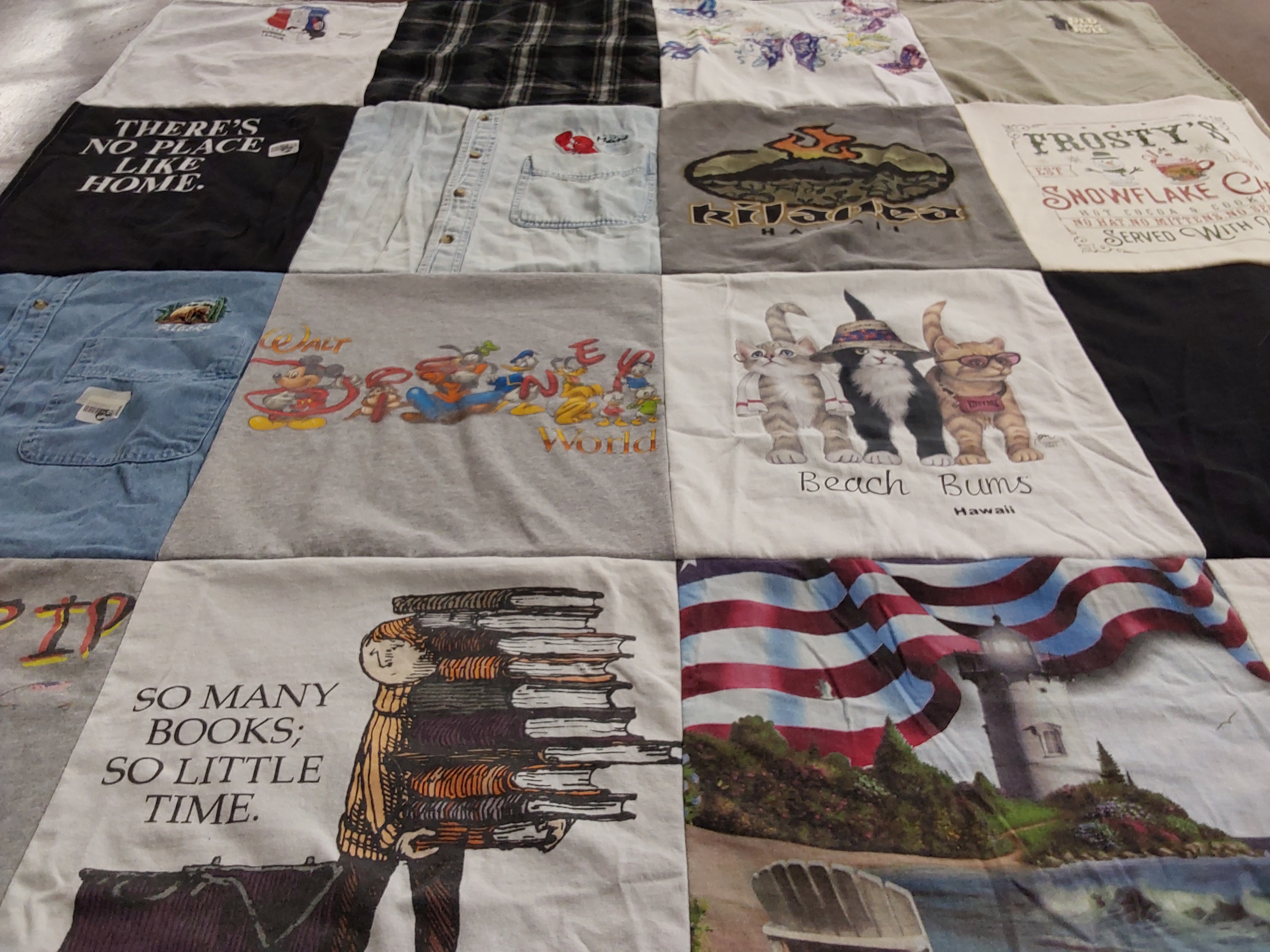 T-shirt quilt with travel, reading themes by Kristen from MA