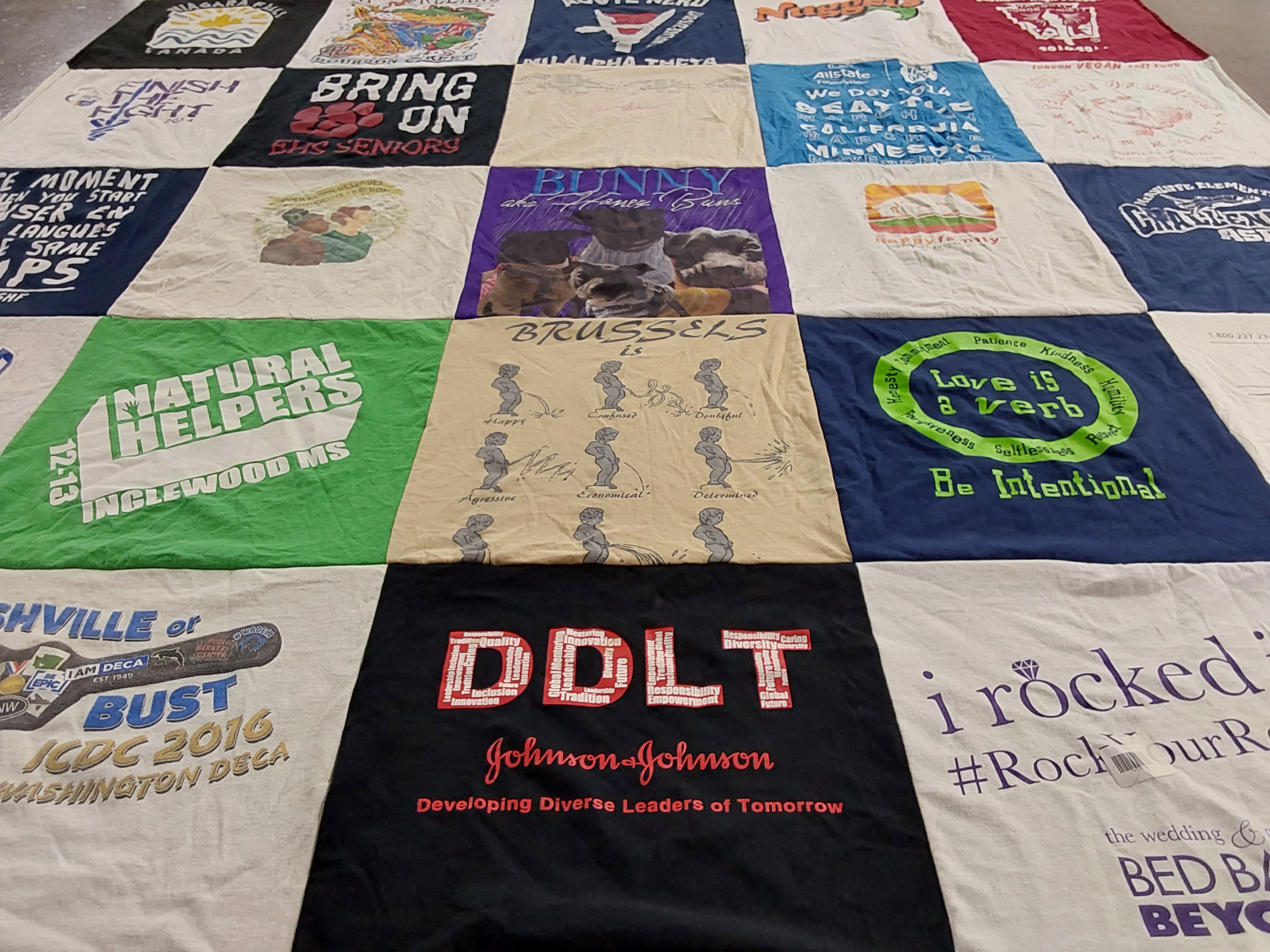 T-shirt quilt with community, education themes by Shamile from NY