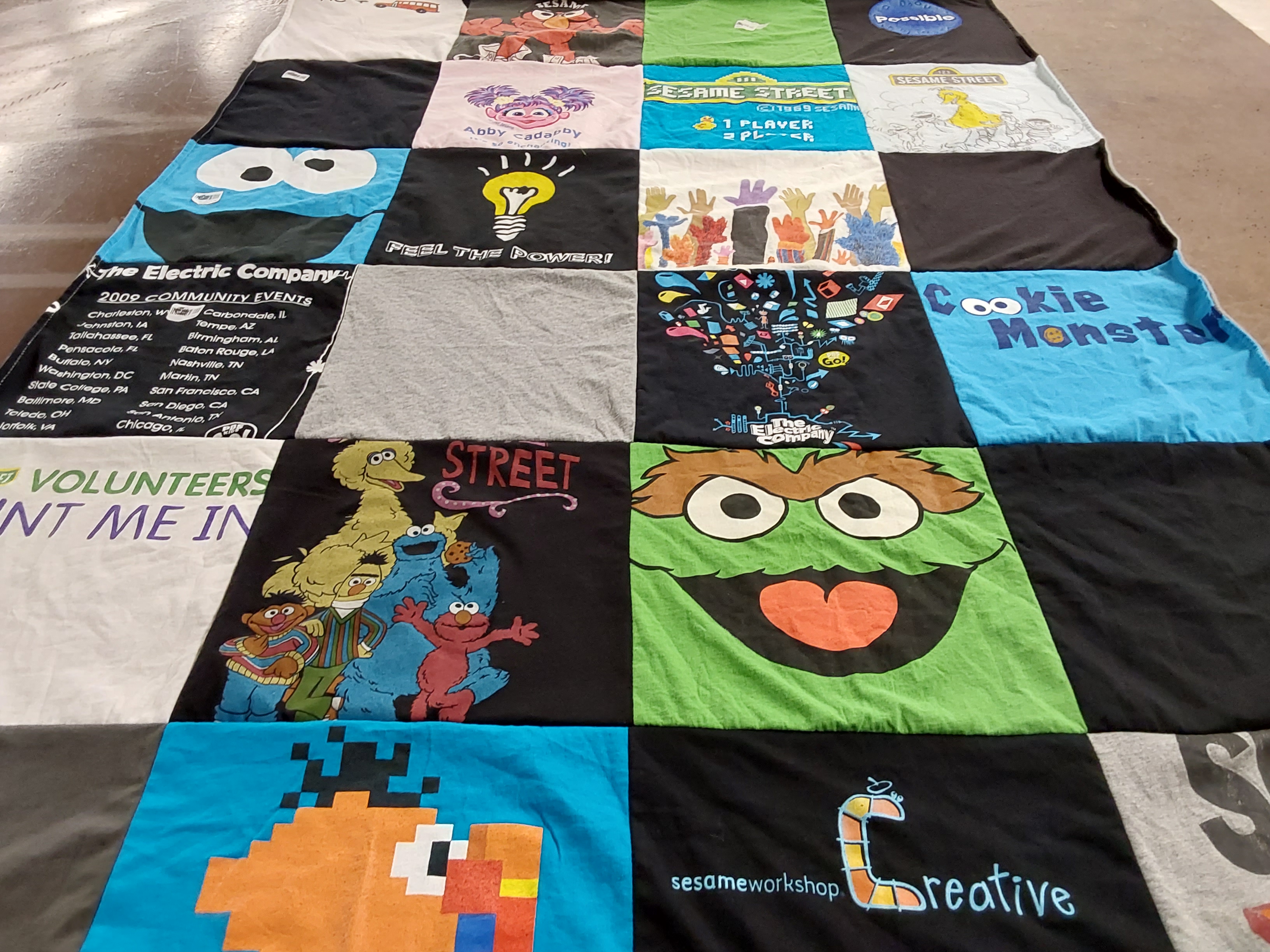 T-shirt quilt with children's education, theatre themes by Sabine from NY