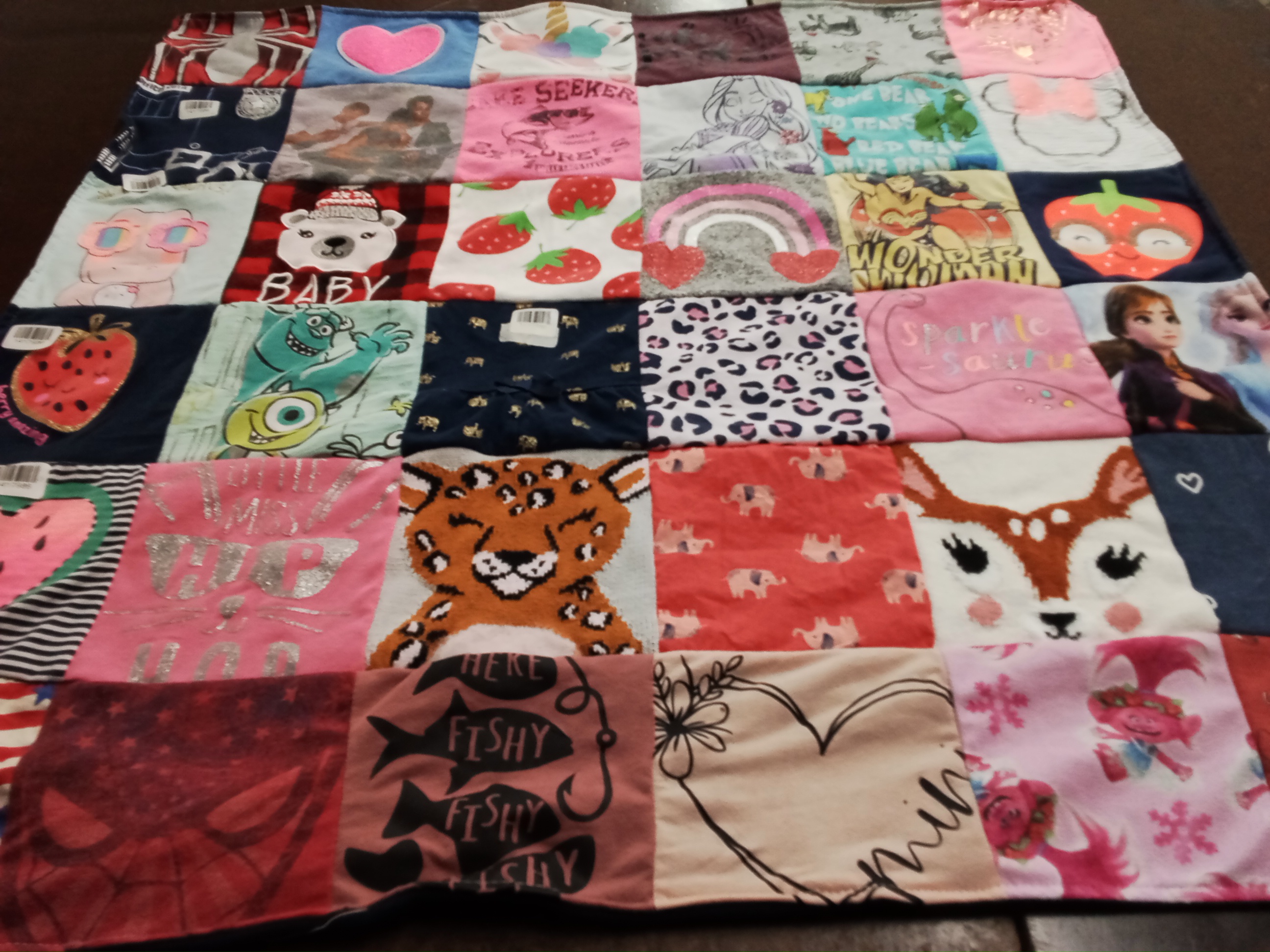 T-shirt quilt with animals, cartoons themes by Michelle from IA