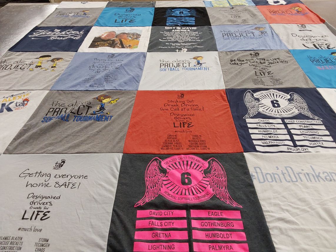 T-shirt quilt with sports, community themes by Matthew from KS