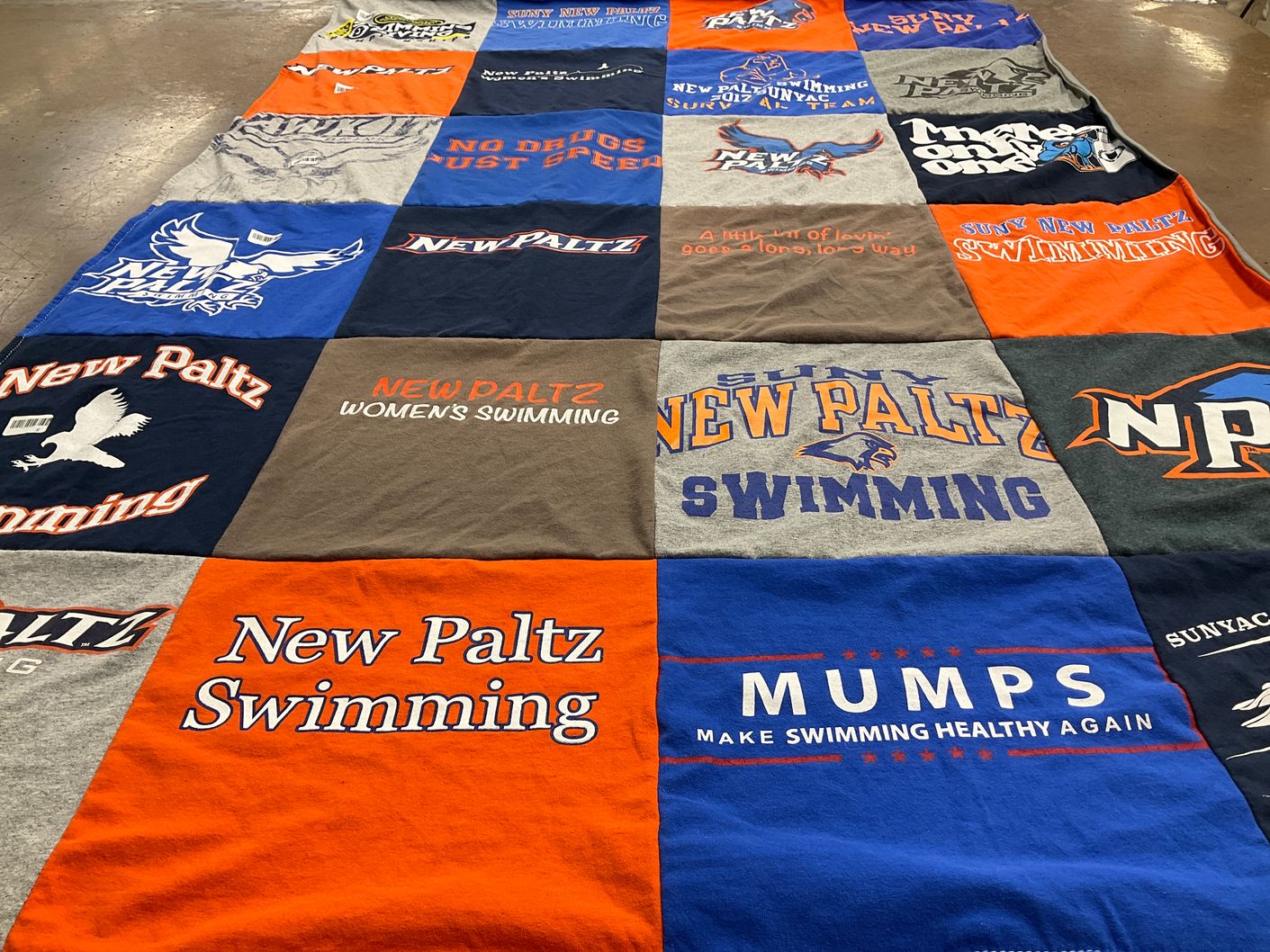 T-shirt quilt featuring state university of new york at new paltz swimming by Lorri from NY
