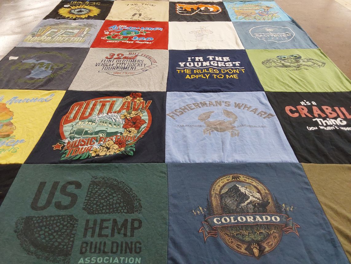 T-shirt quilt with music, fishing themes by Sue from MI