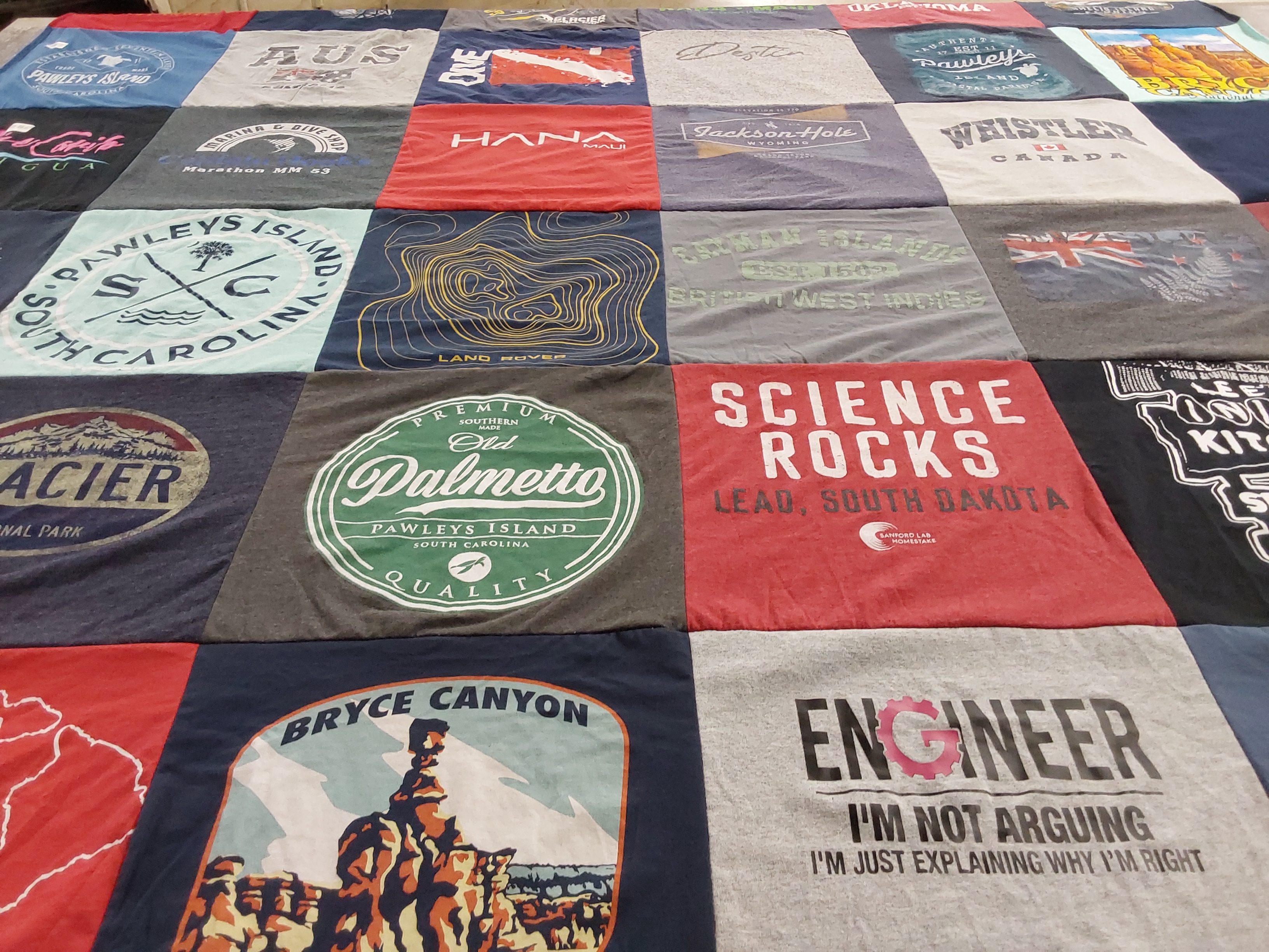 T-shirt quilt with travel, engineering themes by Amy from VA