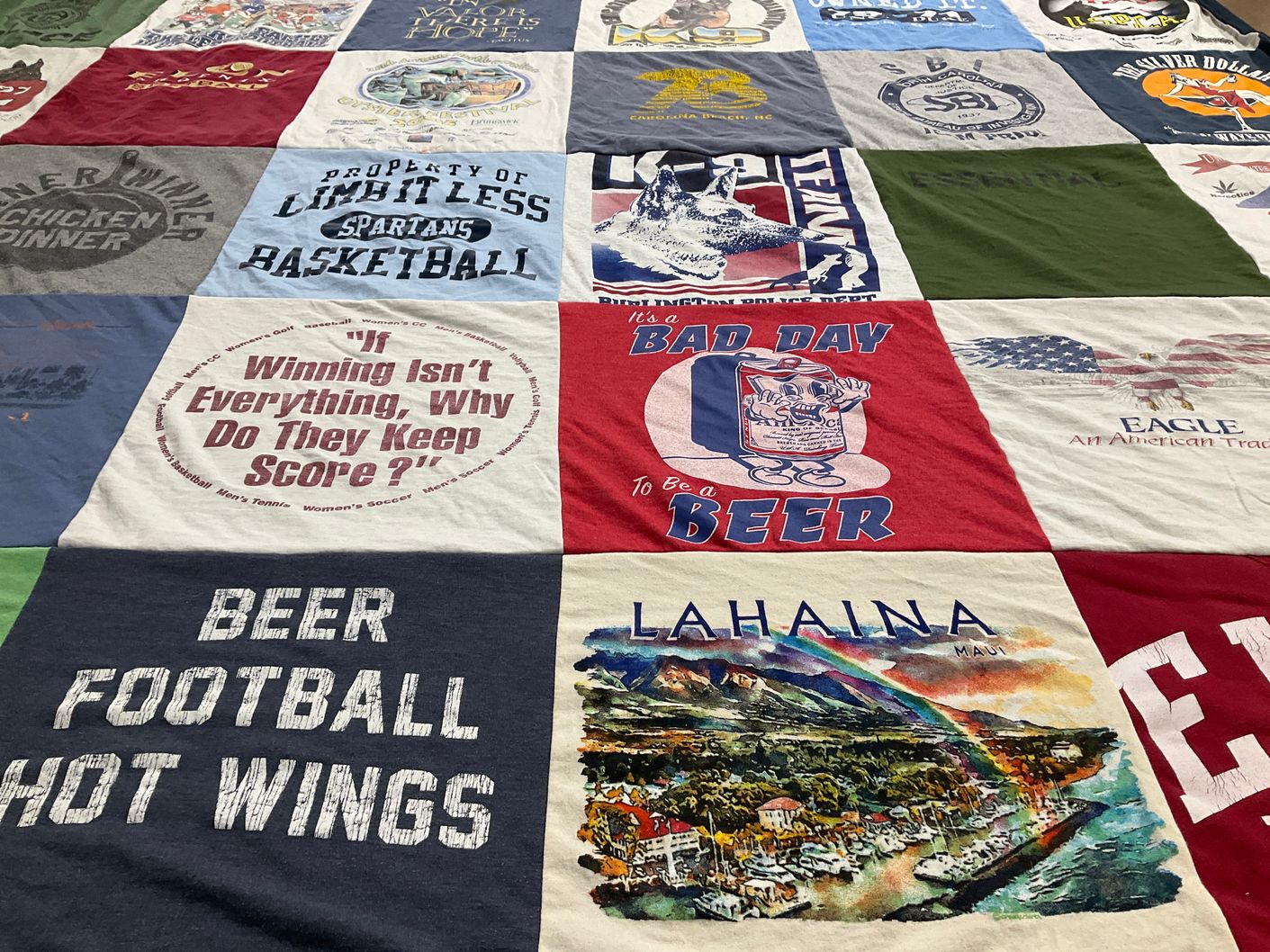 T-shirt quilt with sports, drinking themes by Dorothea from NC
