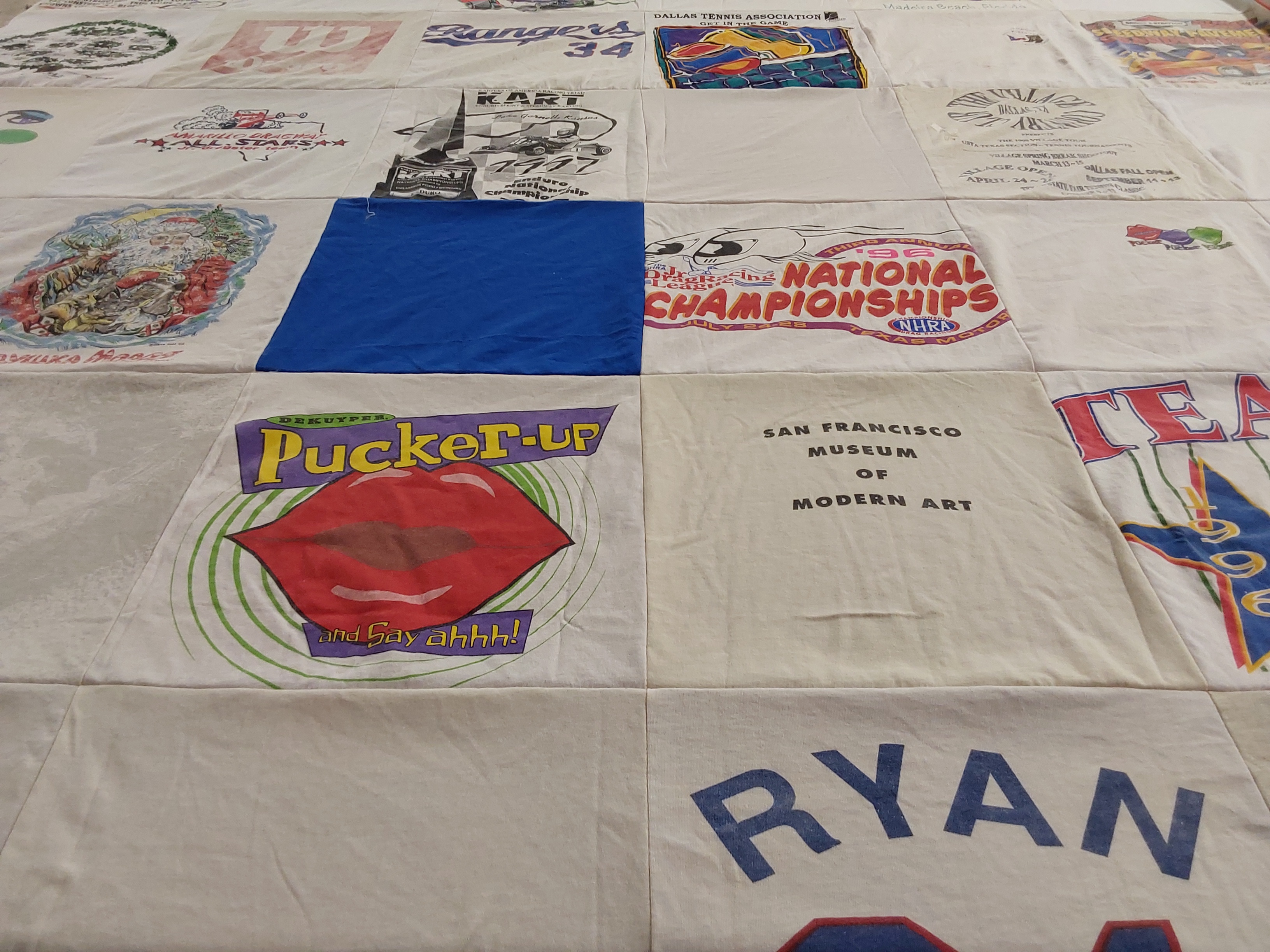 T-shirt quilt with sports, art themes by Jane from TX