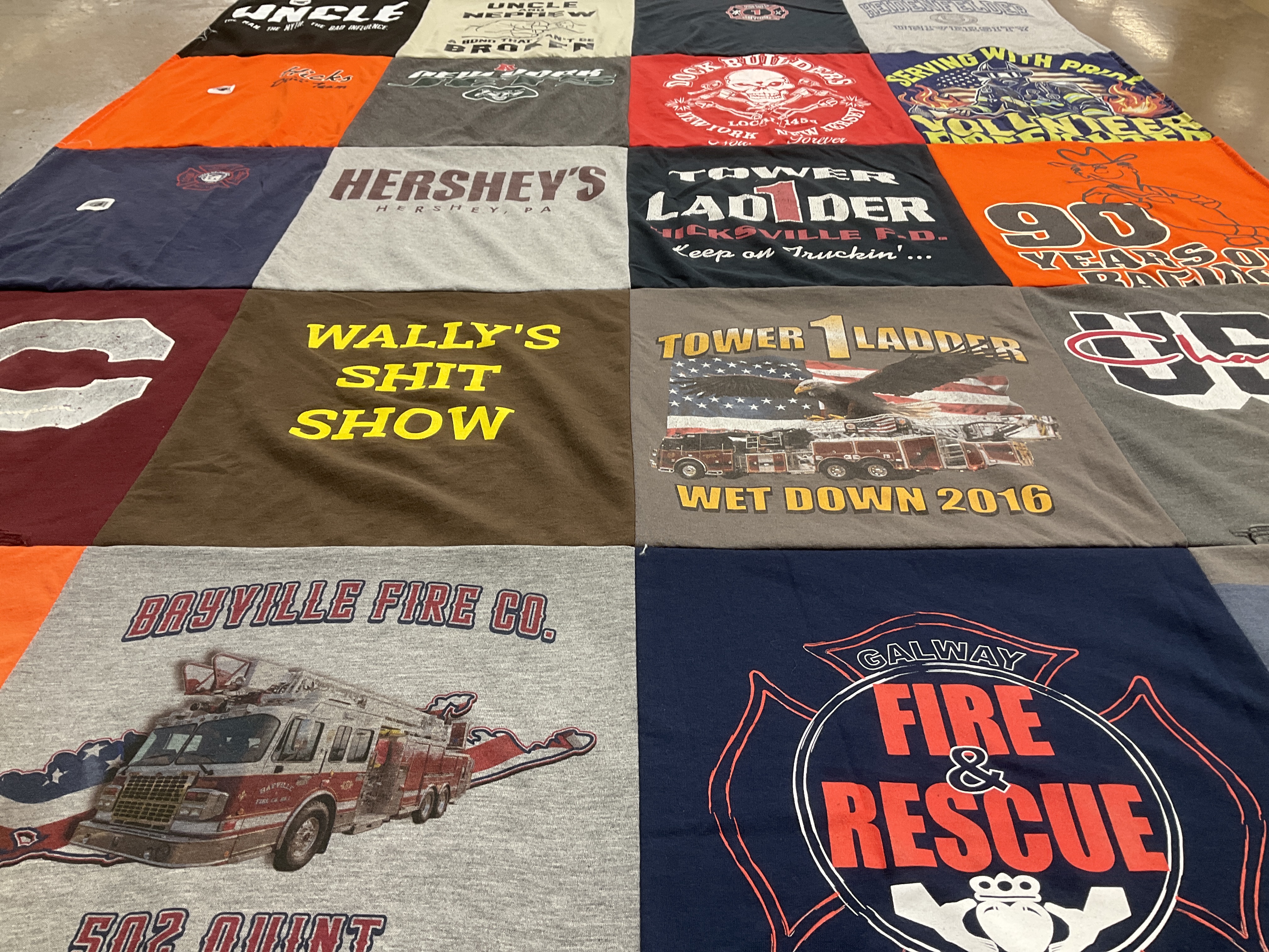 T-shirt quilt with firefighting, community service themes by Michelle from NY