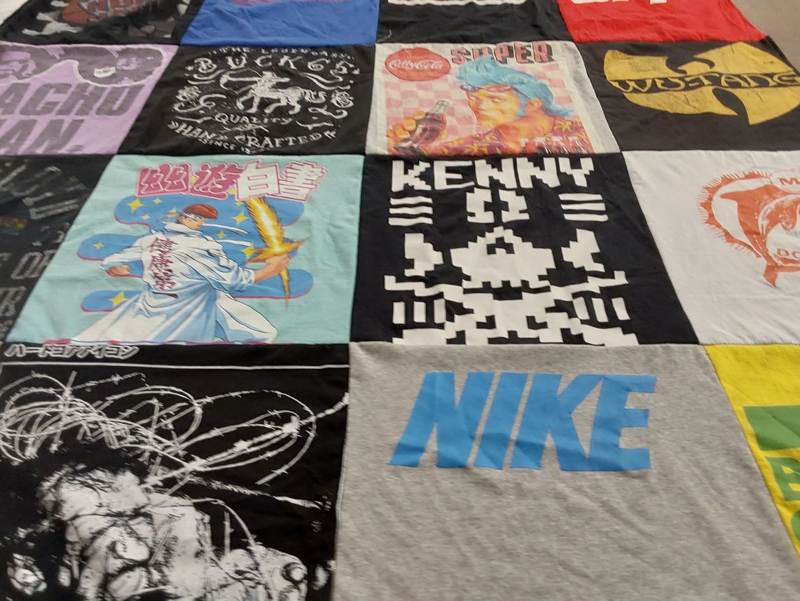 T-shirt quilt with anime, music themes by Linda from MI