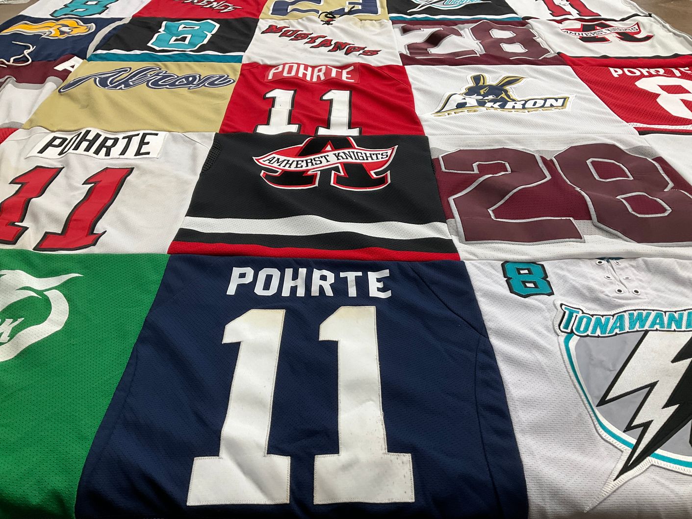 T-shirt quilt with hockey, sports themes by Tina from NY