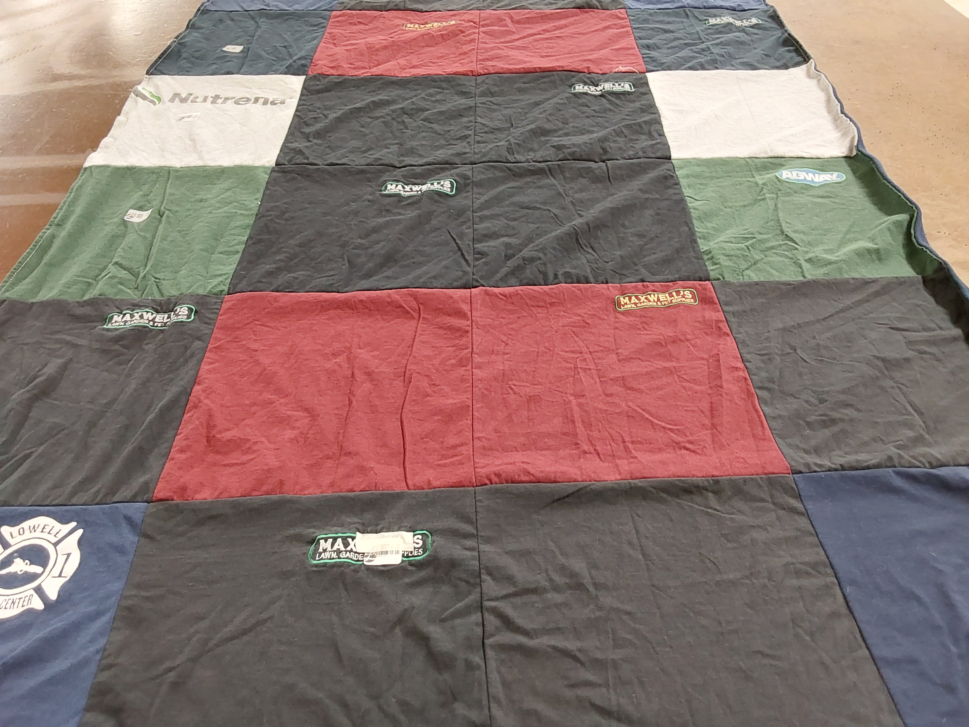 T-shirt quilt with gardening, animal husbandry themes by Amanda from RI