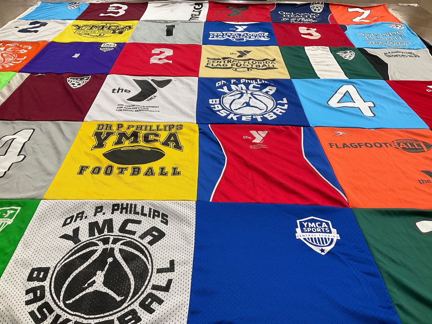 T-shirt quilt with sports, youth programs themes by Jeannette from FL