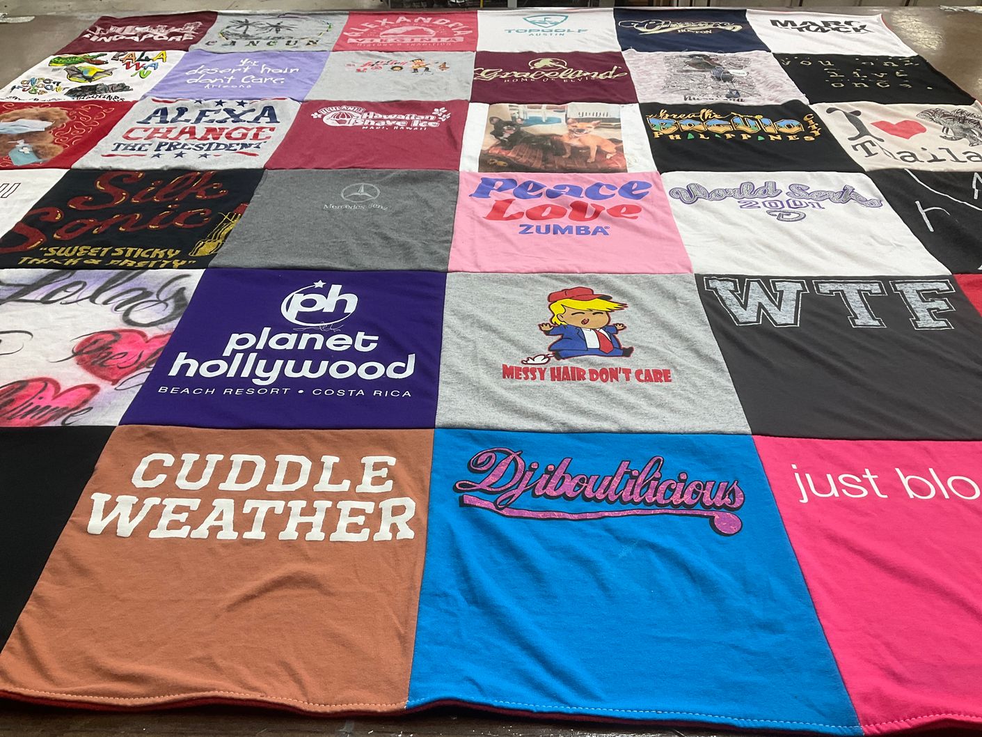 T-shirt quilt with travel, fitness themes by Jeannette from CA