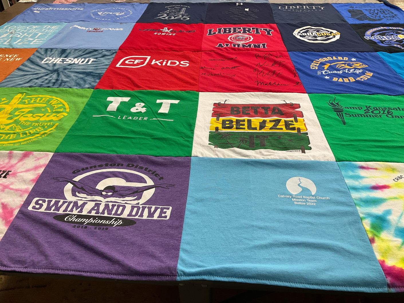 T-shirt quilt featuring gunston district swim and dive by Sam from VA