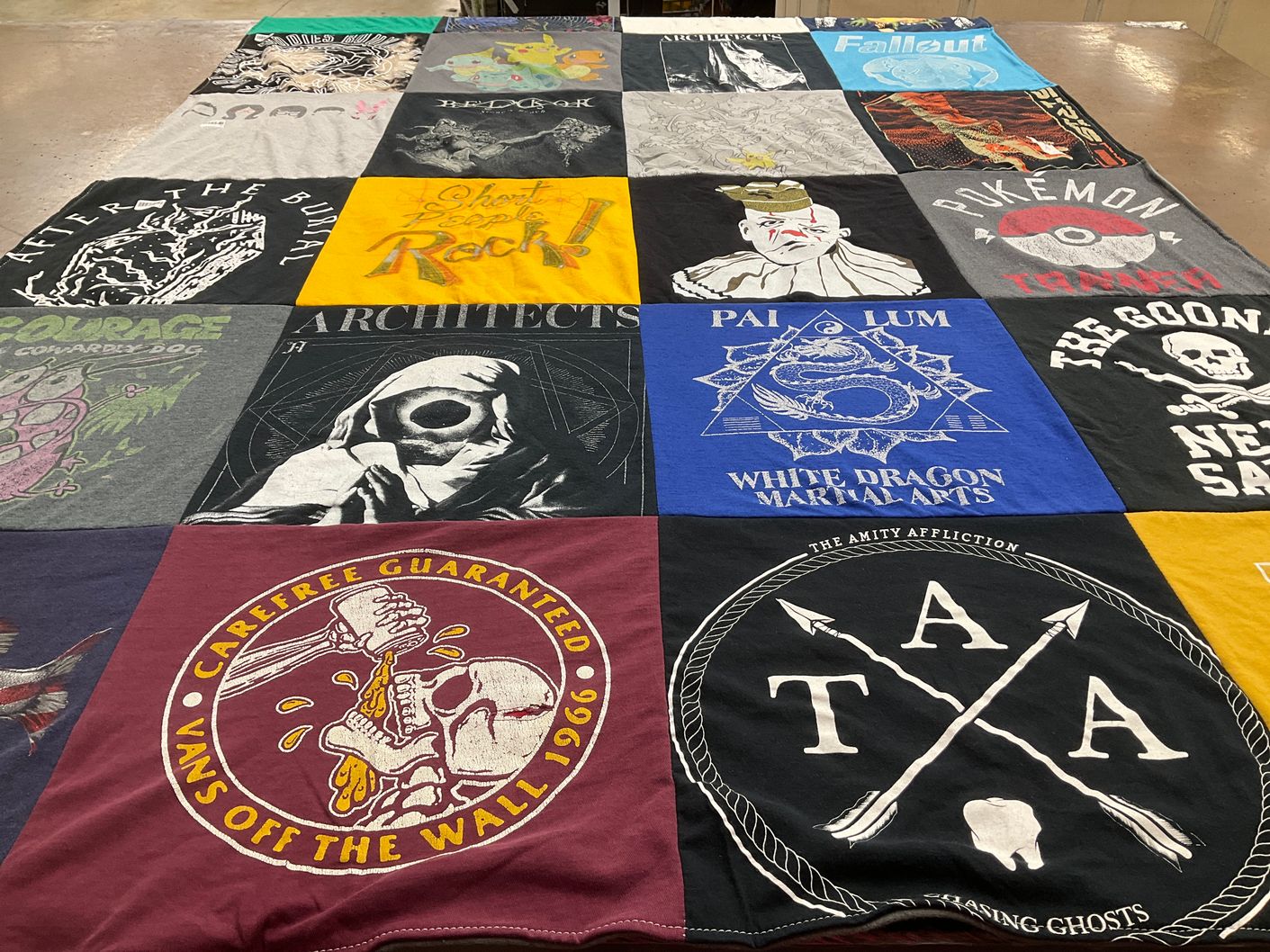 T-shirt quilt with metal music, video games themes by Bethany from CO